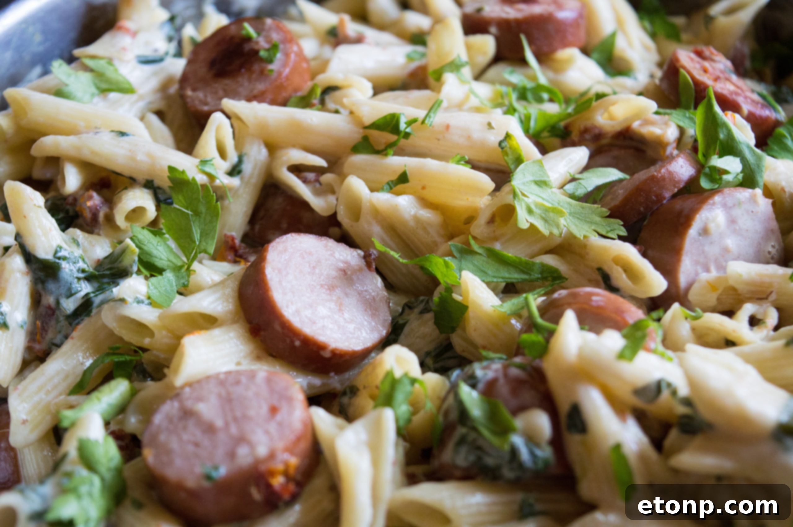 A serving bowl filled with creamy mozzarella pasta, ready to be placed on the dinner table.