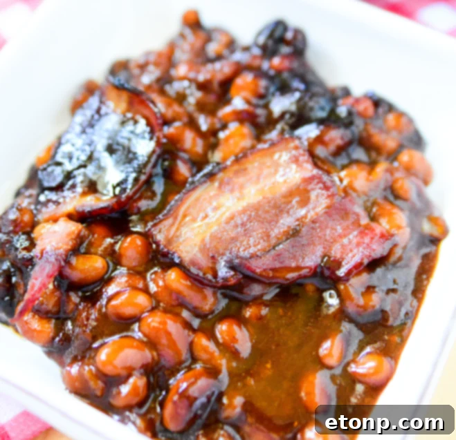 Ultimate Brown Sugar Bacon Baked Beans 2 Delicious brown sugar bacon baked beans in a casserole dish