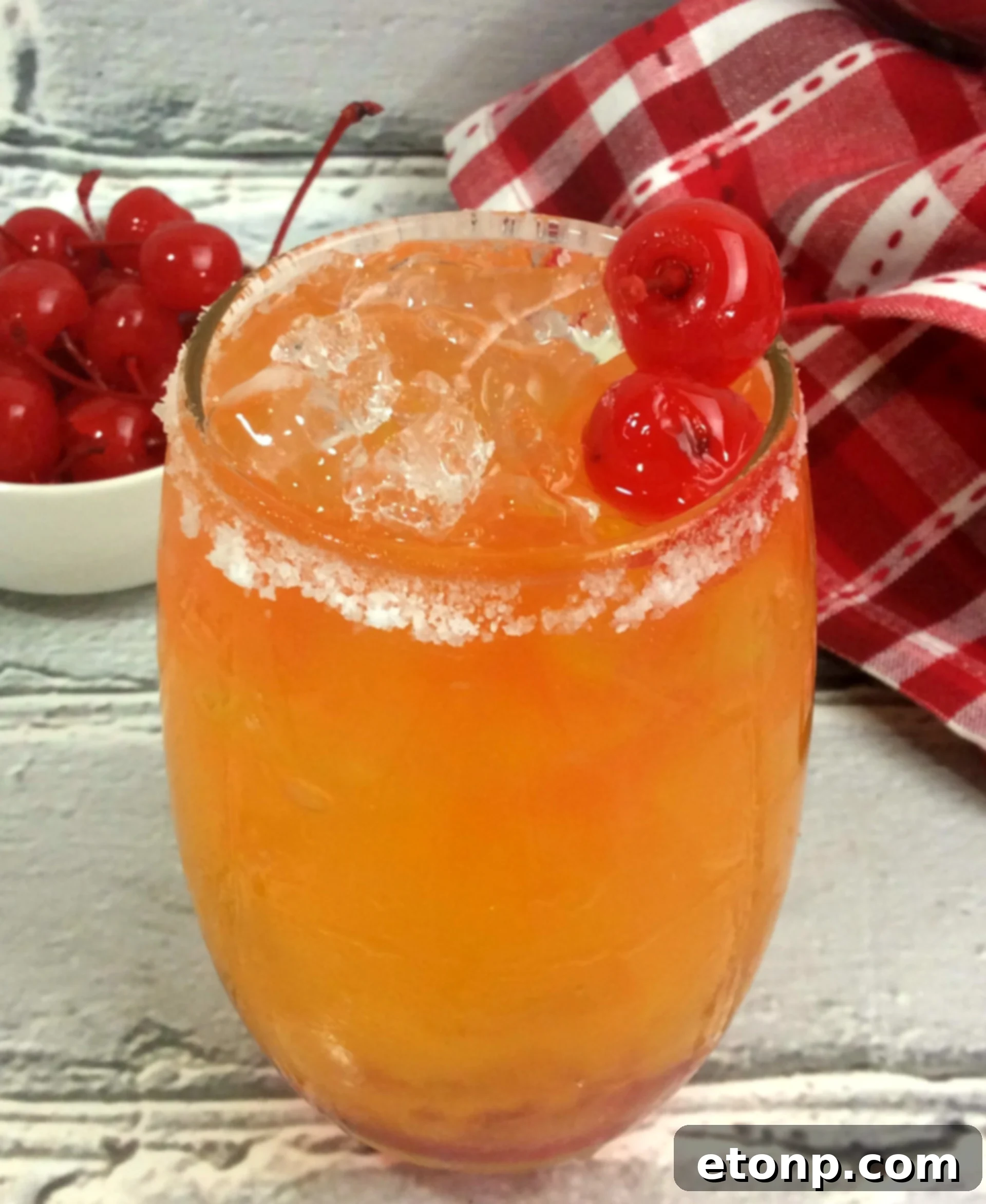 Delicious Take Me on the Couch Cocktail with pineapple and mango garnish, perfect for a relaxing evening.