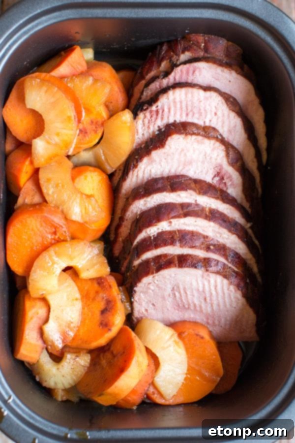 Hearty Slow Cooker Ham and Sweet Potatoes mixture in a crock pot