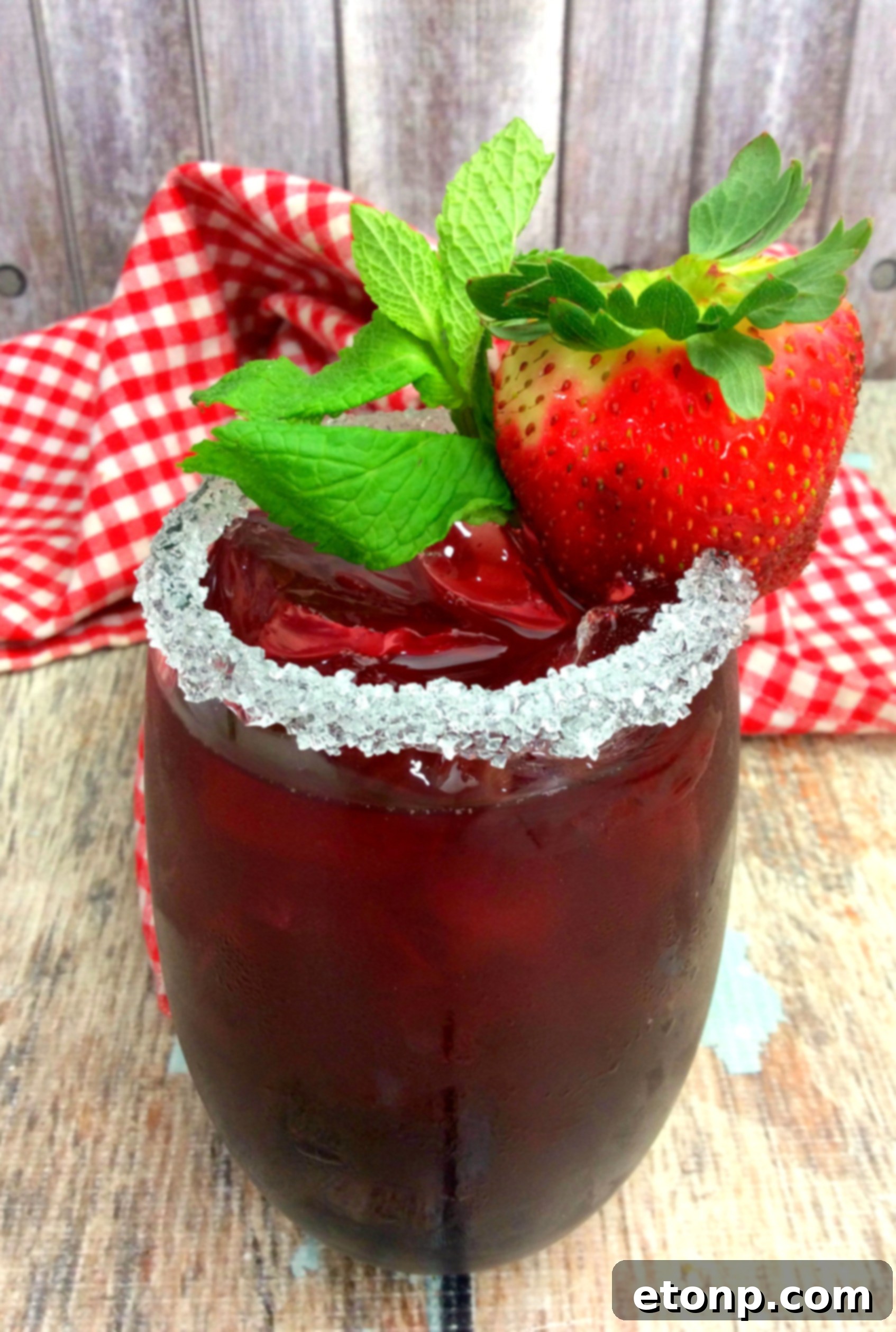 Beautifully garnished strawberry cocktail, ideal for a social gathering
