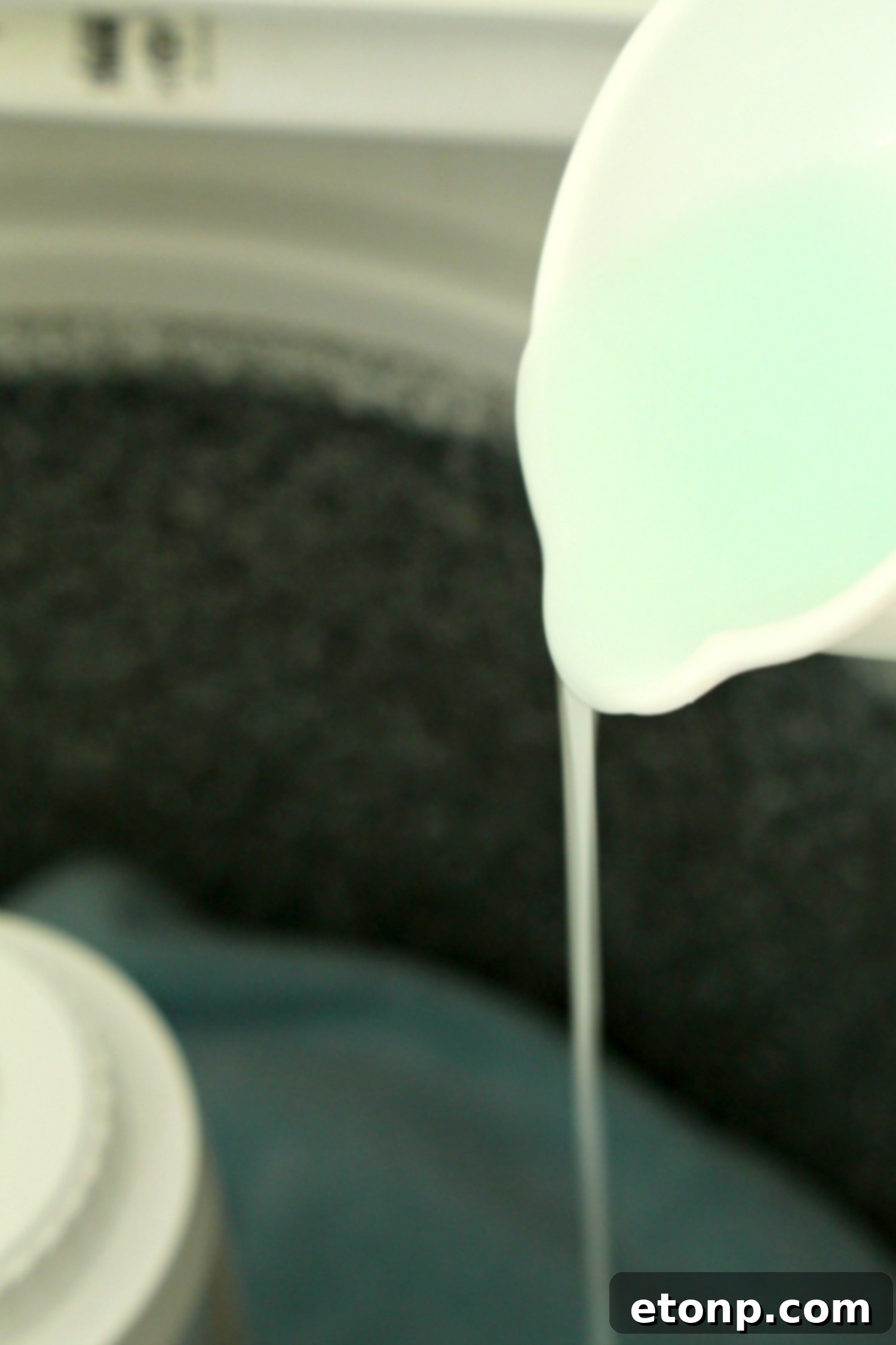 Homemade fabric softener mixture in a clear bottle.