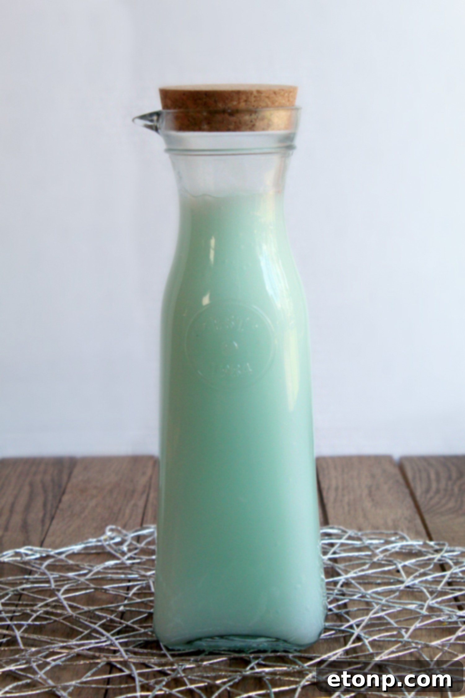 Homemade fabric softener in a labeled bottle, ready for use.