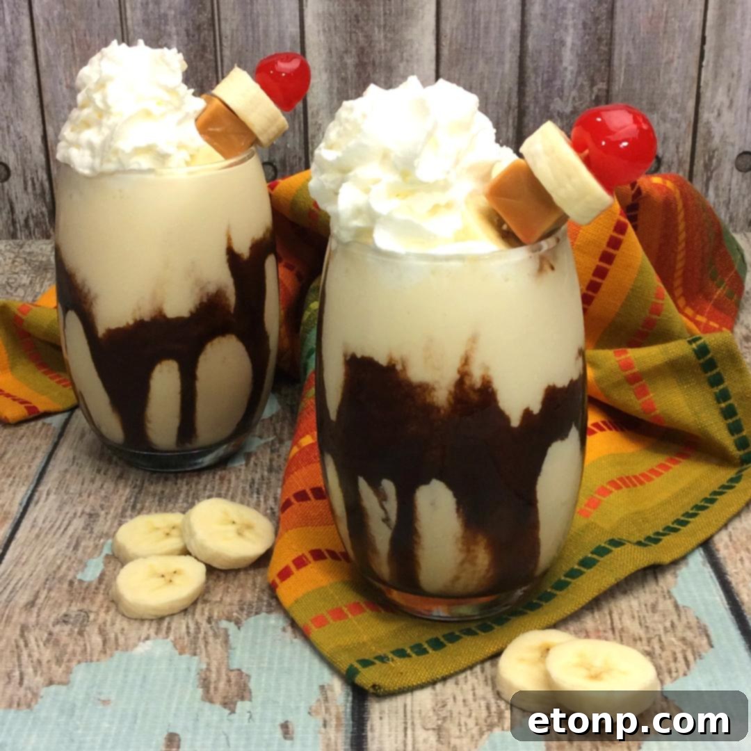A close-up of a Chunky Monkey Cocktail, highlighting the creamy texture and chocolate drizzle in a classic glass