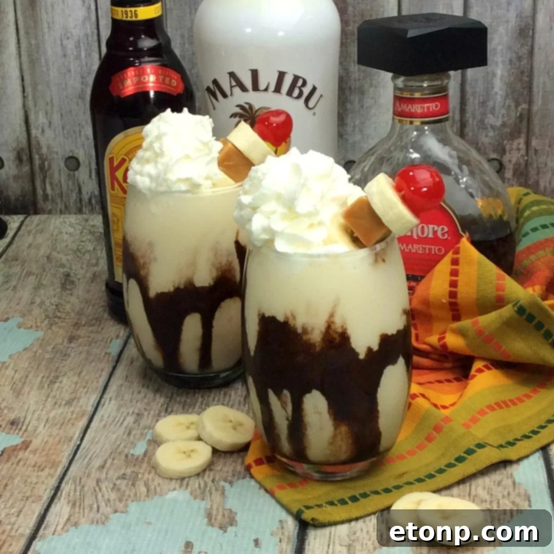 A beautifully presented Chunky Monkey Cocktail, showing the rich, creamy texture and vibrant garnishes of banana and cherry