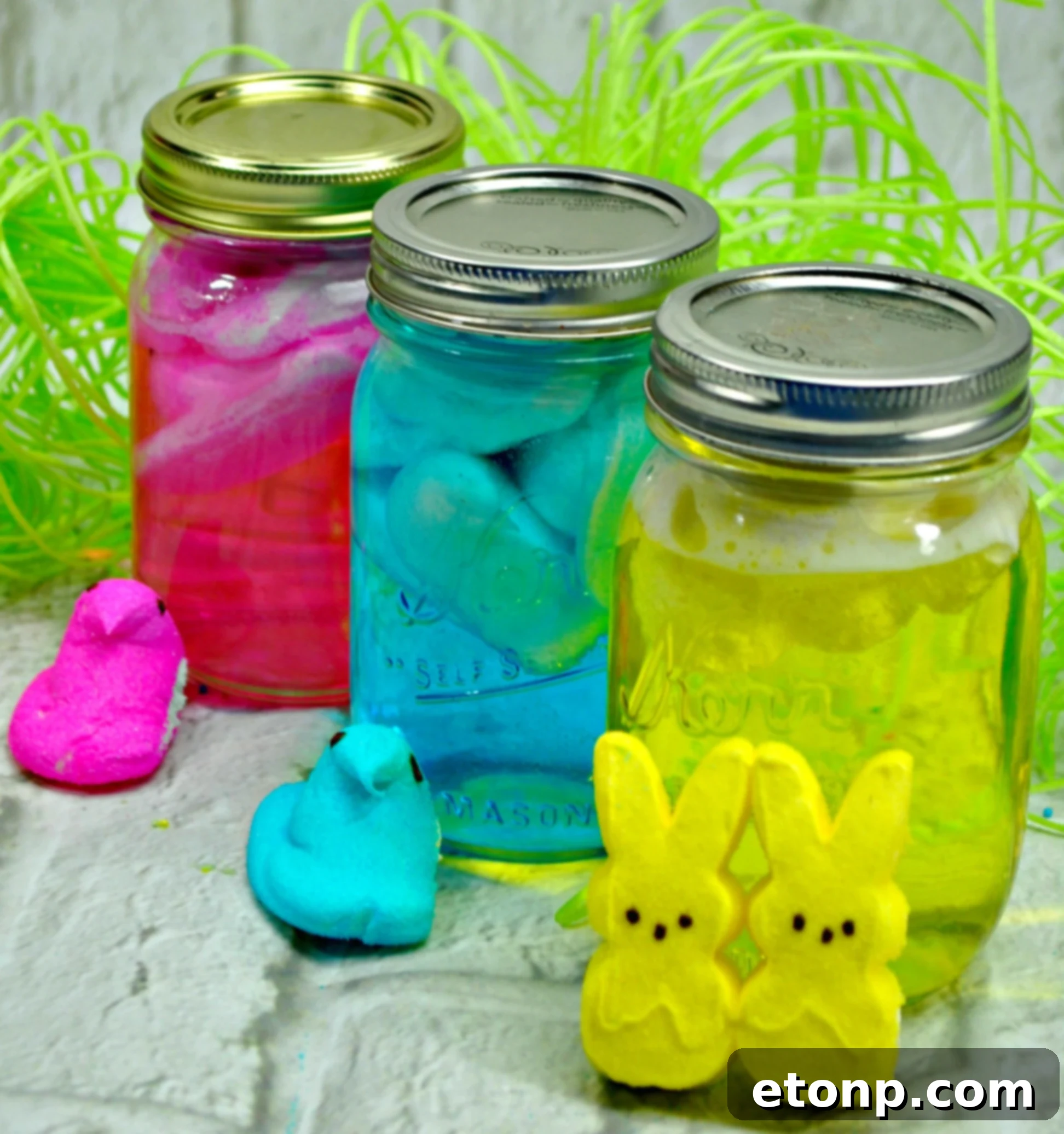 Colorful Peeps dissolving in vodka in a mason jar