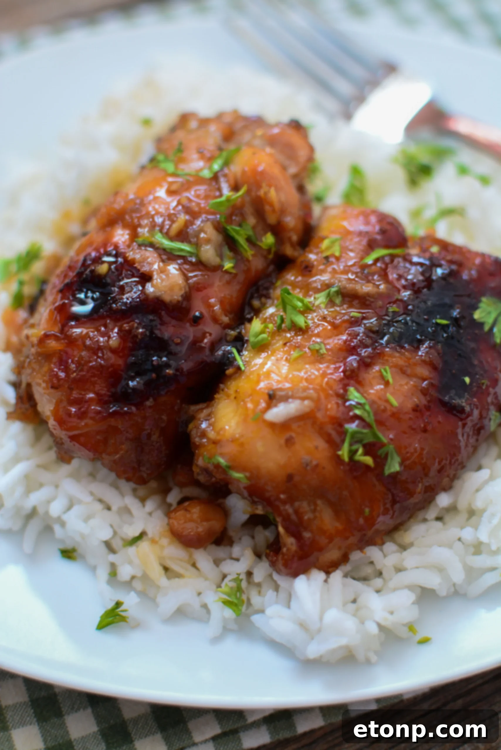 A large serving bowl filled with Crock Pot Garlic Brown Sugar Chicken, ready for a family meal.