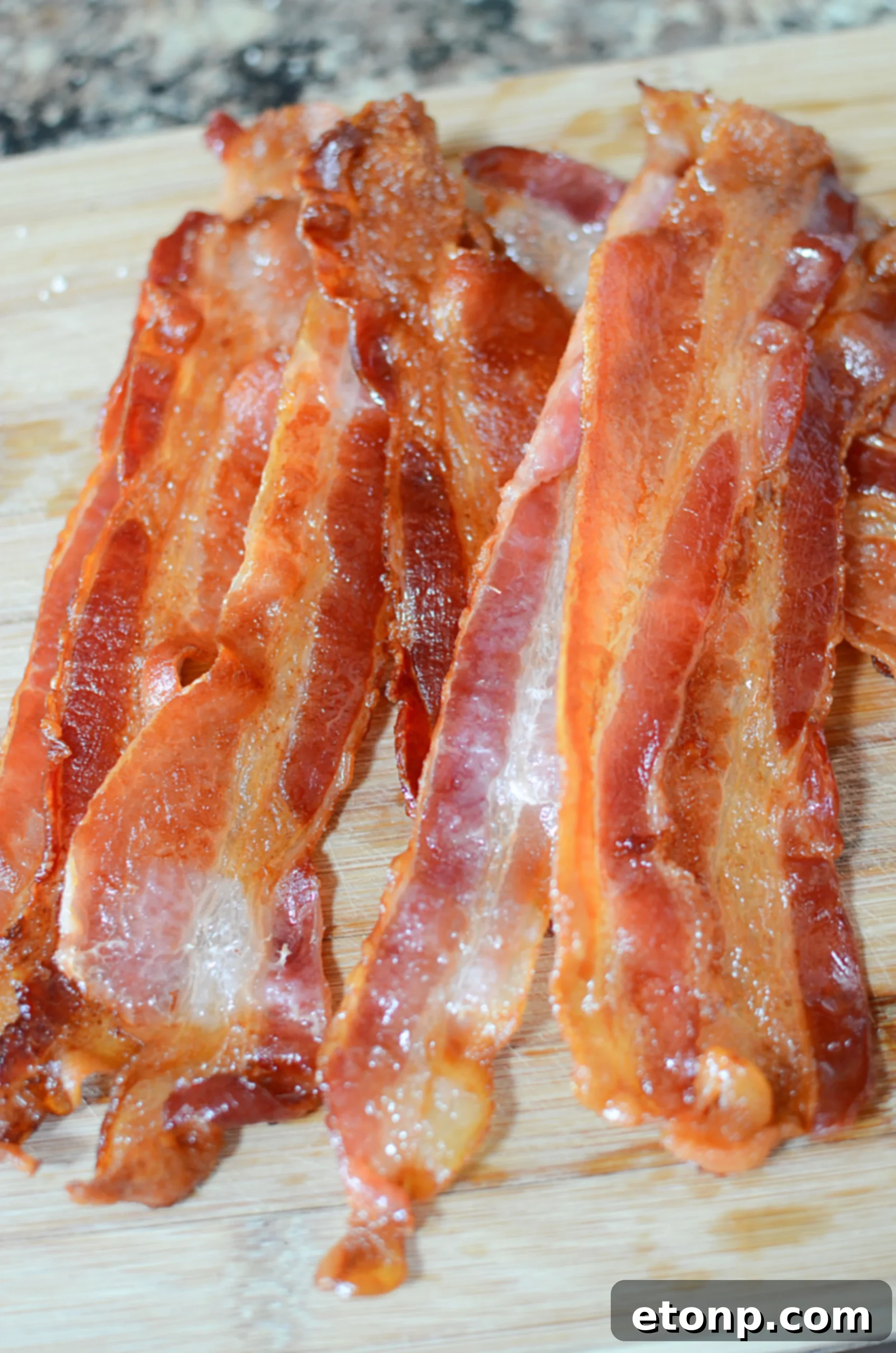 Baked bacon removed from the oven, cooling slightly