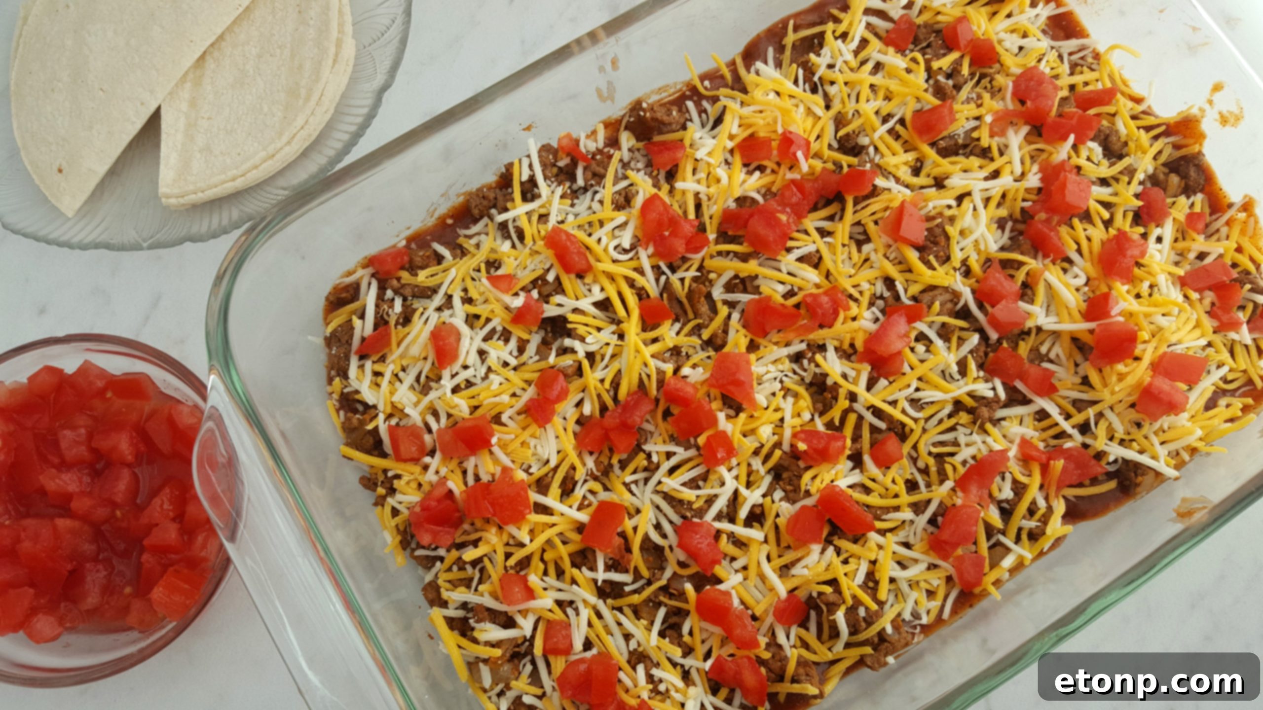 Final baked Mexican Lasagna, golden brown and bubbly