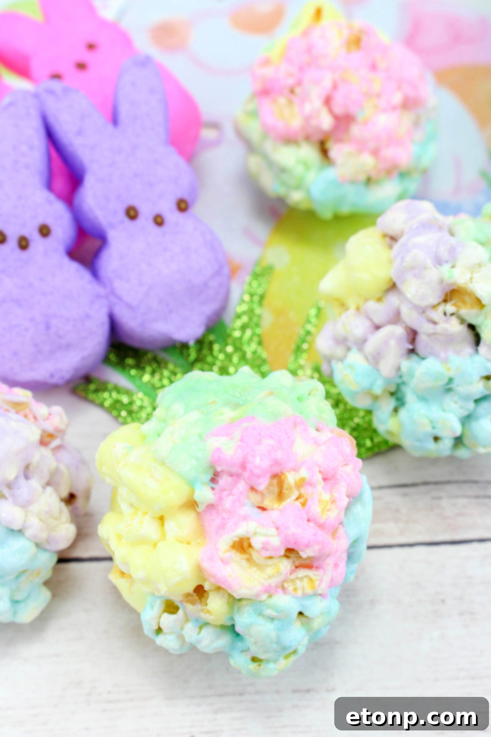 Close-up of colorful marshmallow popcorn balls, showcasing their vibrant colors and appealing texture, perfect for spring.