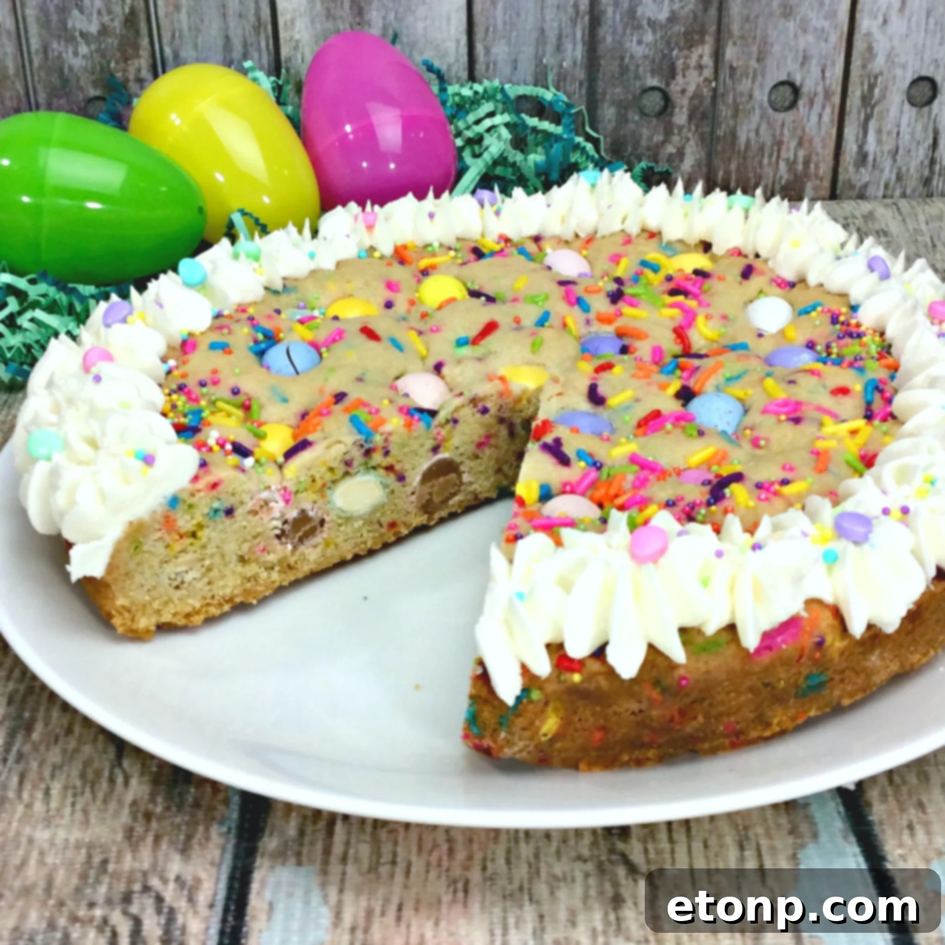 A close-up shot of the Easter Cookie Pie's soft, chewy interior, studded with colorful candies and a hint of vanilla frosting.