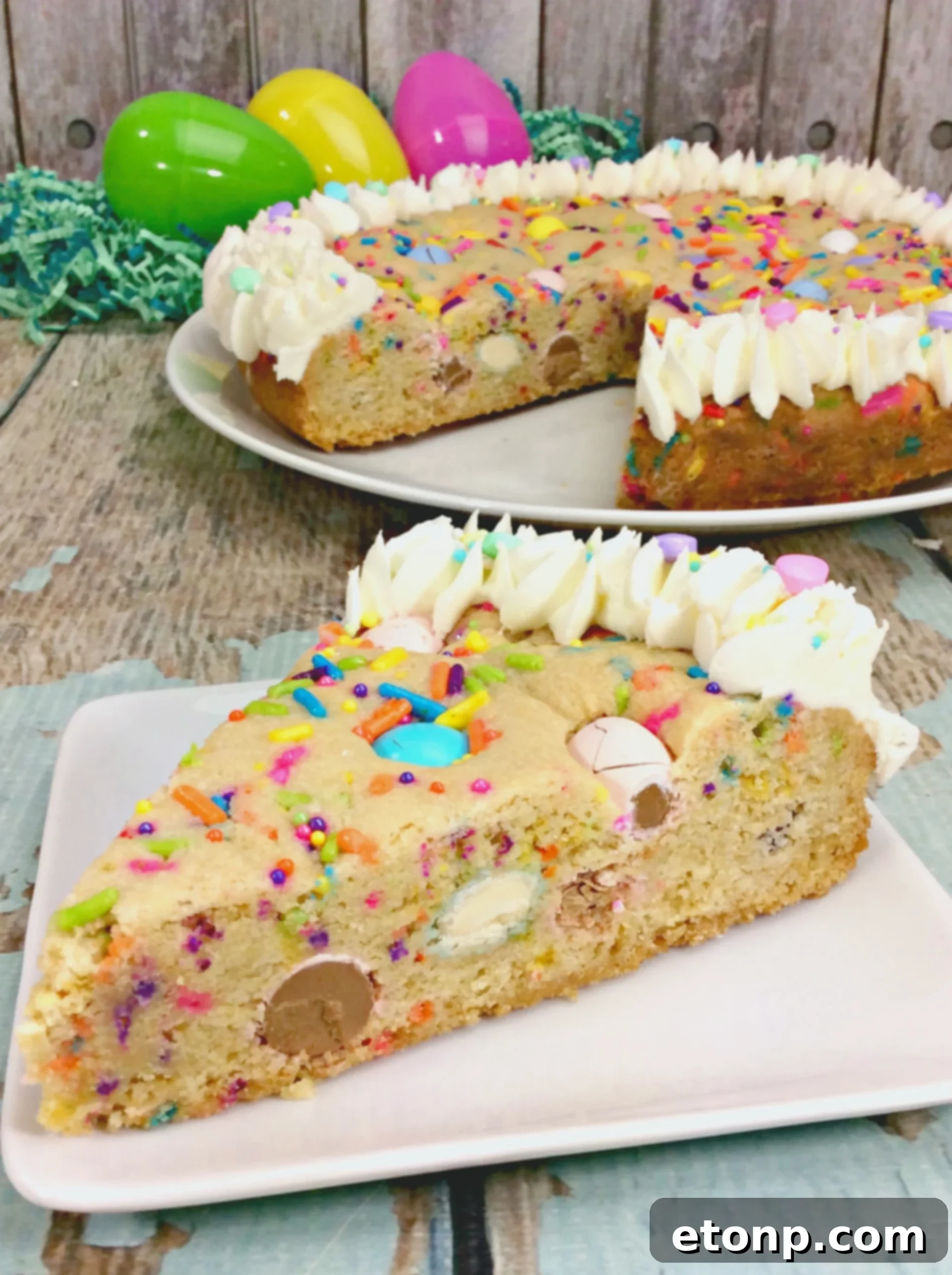 A side view of the freshly baked Easter Cookie Pie, showcasing its golden-brown crust and inviting texture, still in a springform pan.