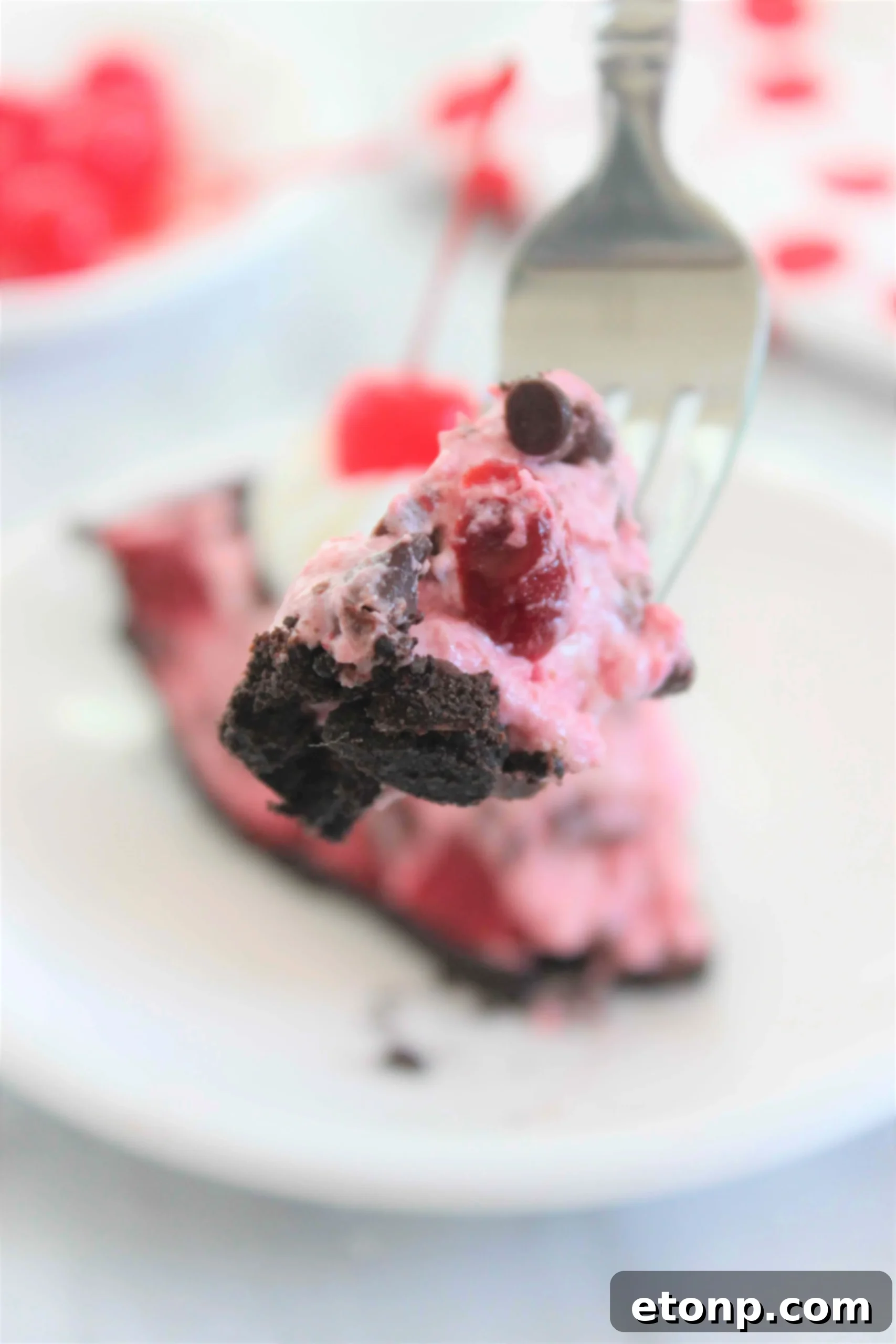 A closer shot of the No-Bake Cherry Chocolate Chip Dreamsicle Pie, highlighting the creamy filling and visible chocolate chips.