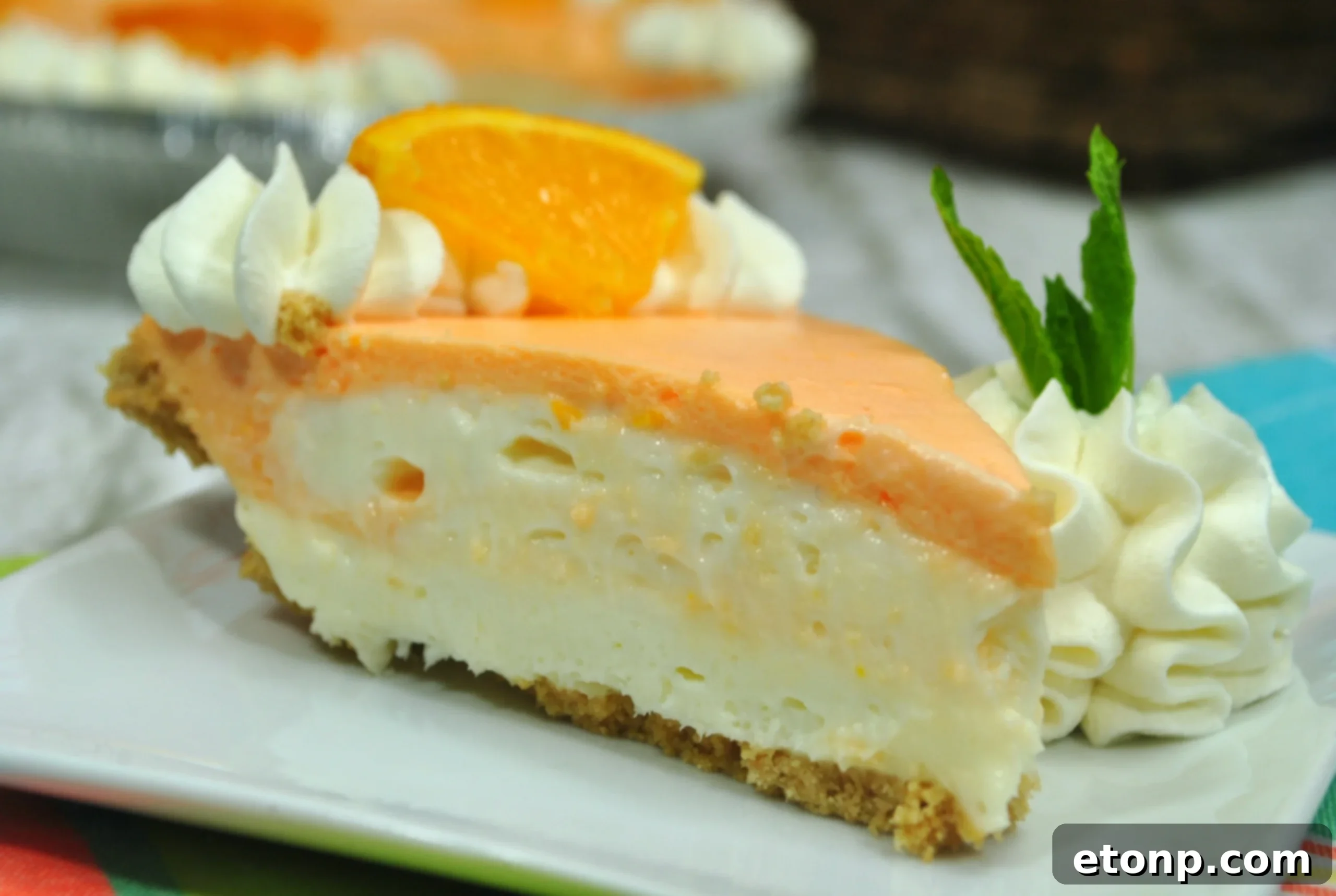 Dreamy No Bake Orange Creamsicle Cheesecake 3 Close-up of Orange Creamsicle Cheesecake showing texture