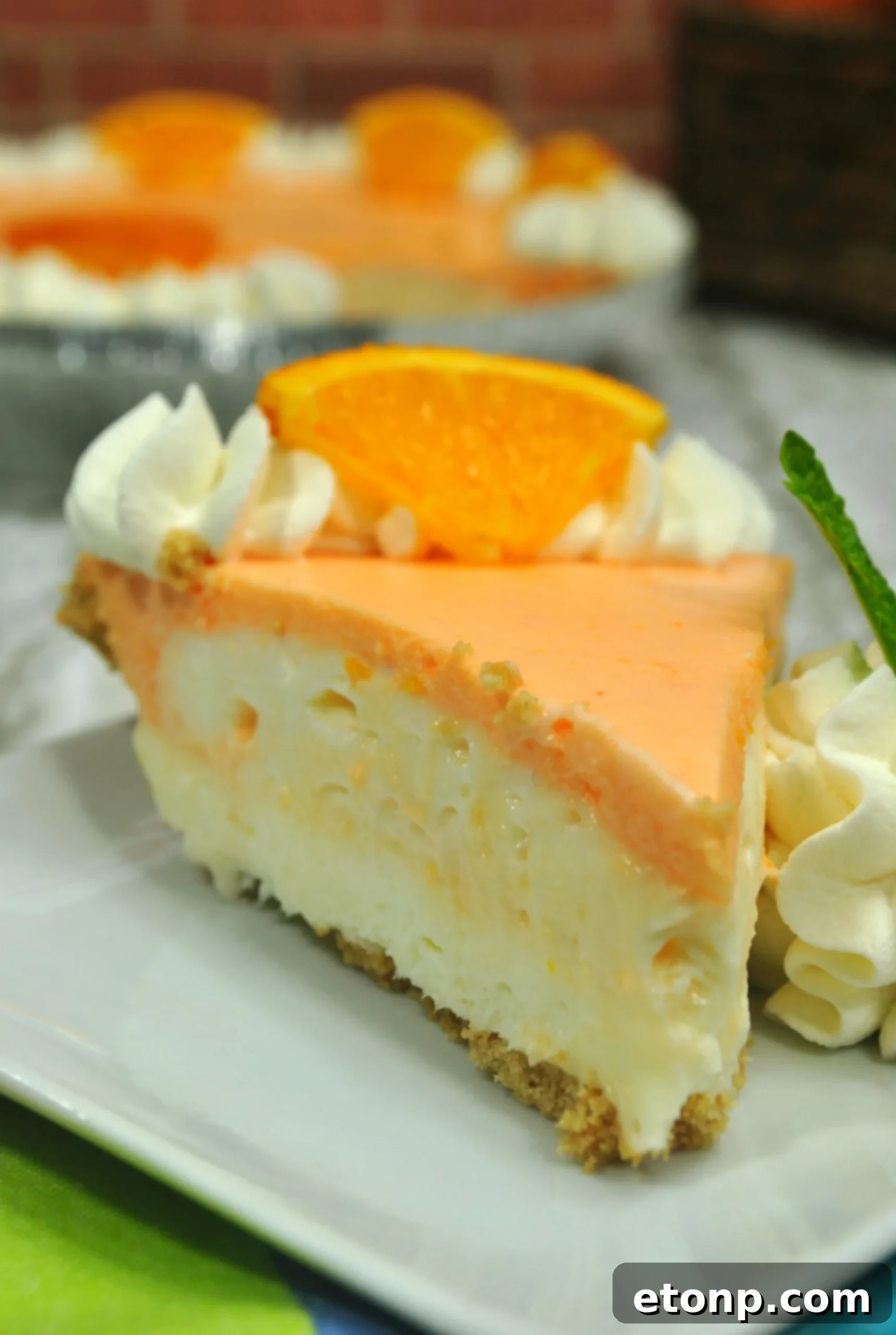 Dreamy No Bake Orange Creamsicle Cheesecake 4 Prepared Orange Creamsicle Cheesecake ready to be served