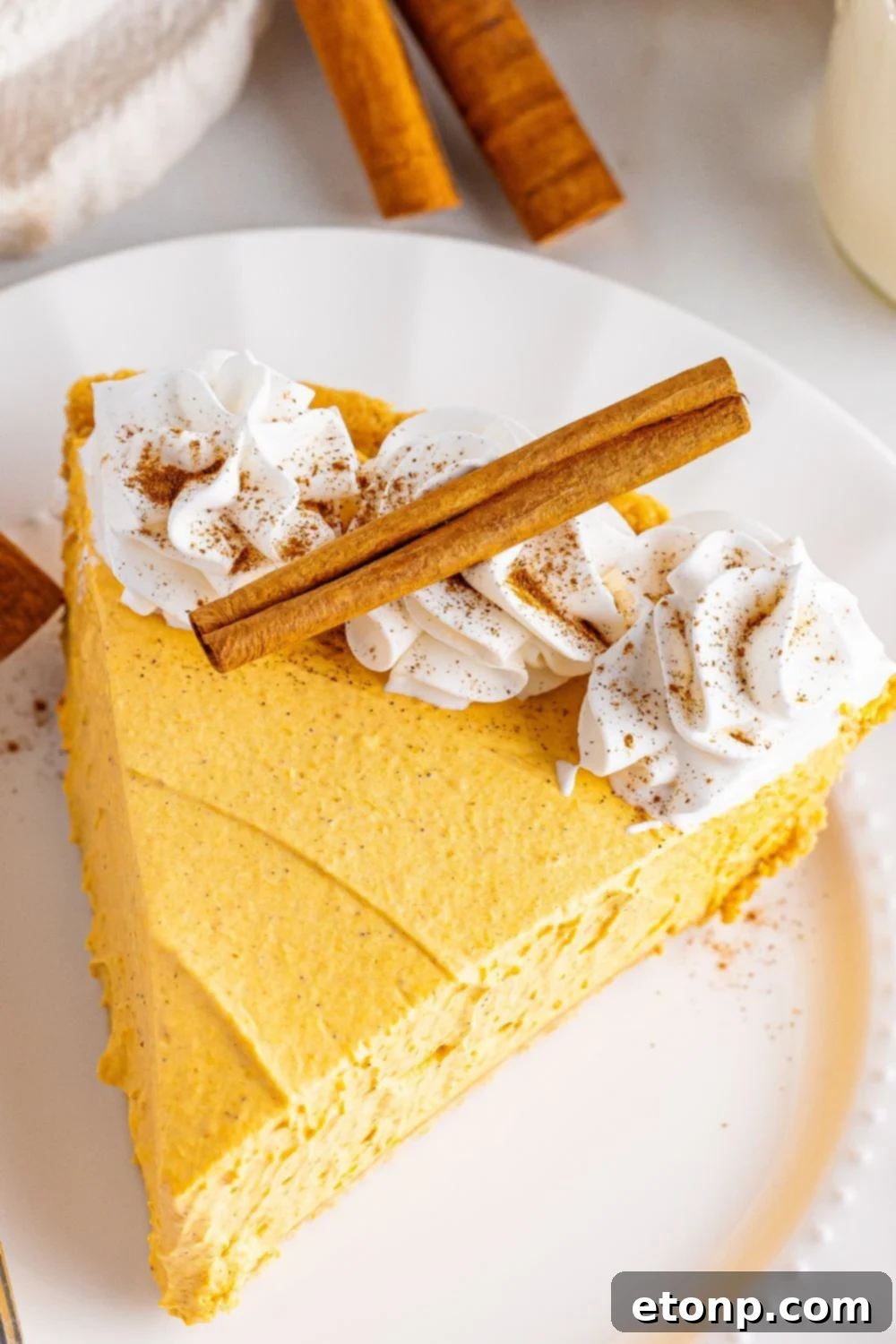 overhead shot of pumpkin cheesecake on plate