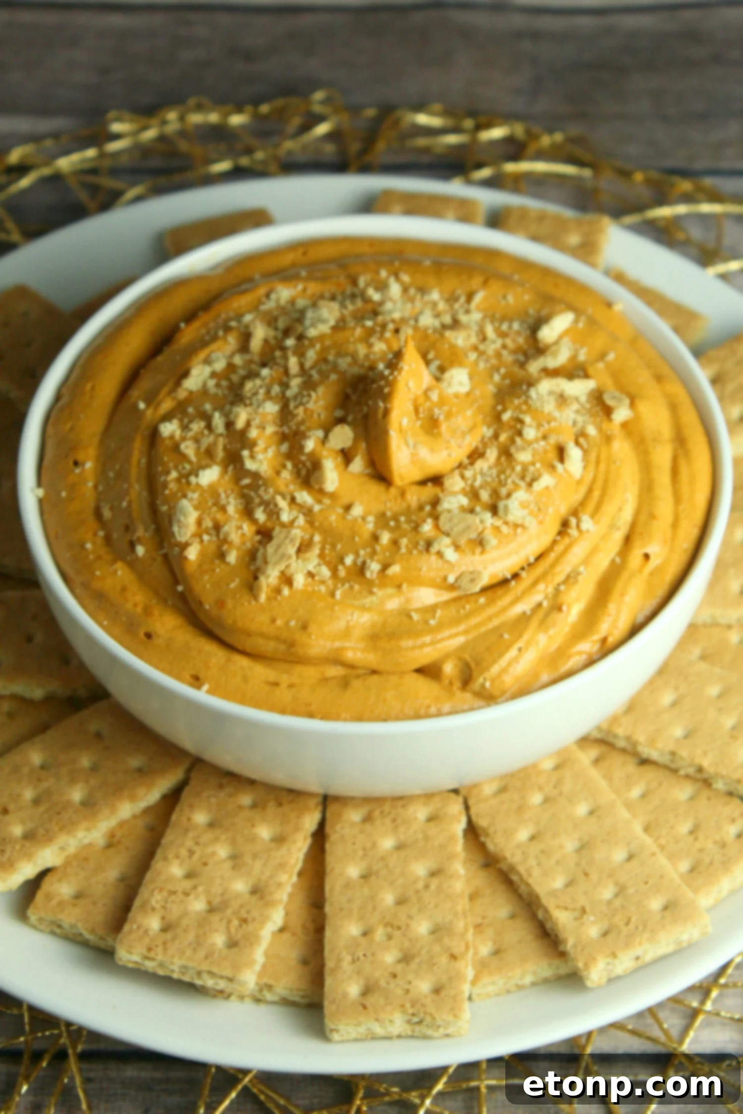 Heavenly Pumpkin Cheesecake Dip 3 Close-up of Pumpkin Pie Cheesecake Dip with various sweet dippers.