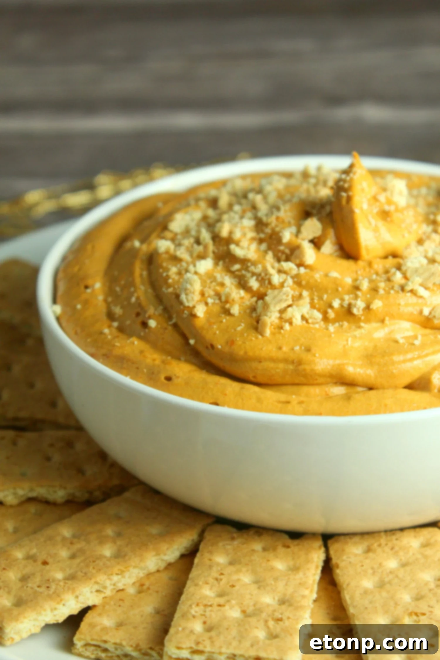 Heavenly Pumpkin Cheesecake Dip 6 Pumpkin Pie Cheesecake Dip ready for serving at a fall party.