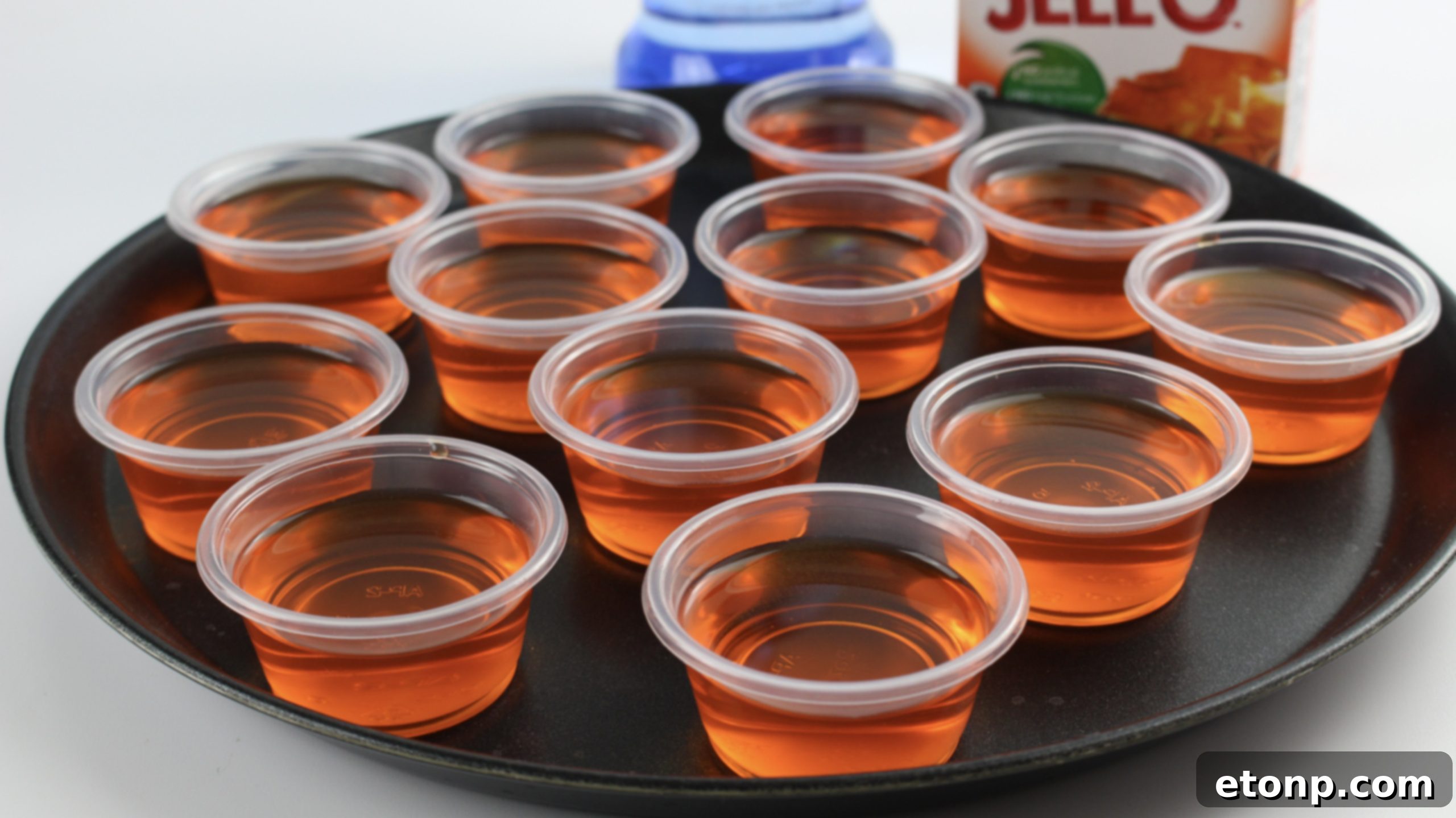A tray of Orange Creamsicle Jello Shots, glistening and ready to serve, highlighting their perfect consistency and inviting appearance.