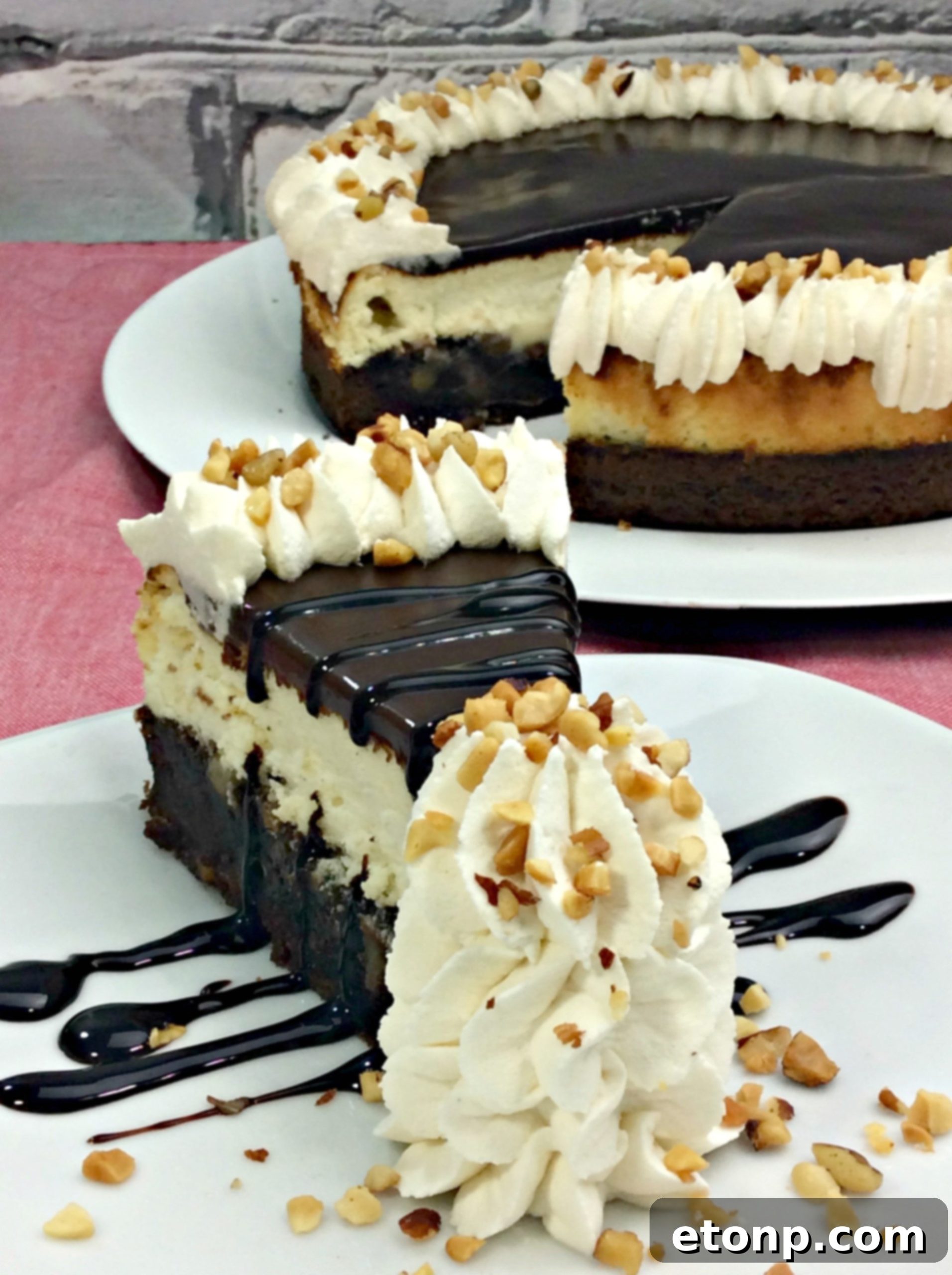 A large, tempting image of the complete Hot Fudge Sundae Brownie Cheesecake, ready to be served
