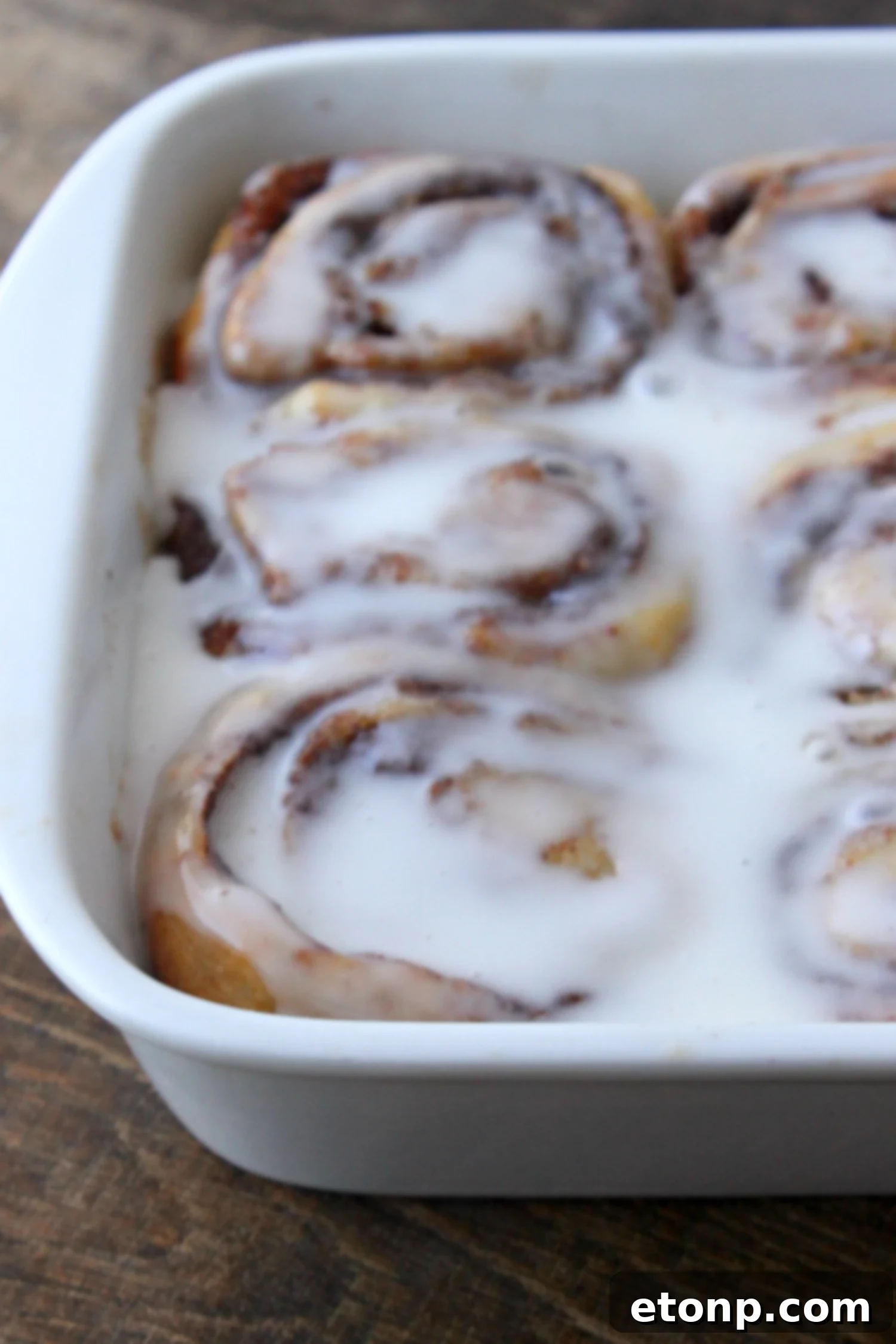 45 Minute Cinnamon Roll Magic 11 A plate piled high with golden-brown cinnamon rolls, invitingly soft and sweet.