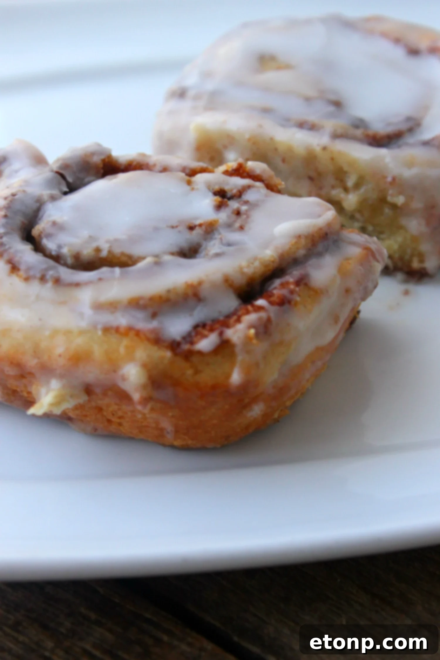 45 Minute Cinnamon Roll Magic 12 Detailed close-up of the cinnamon roll's texture and abundant icing.