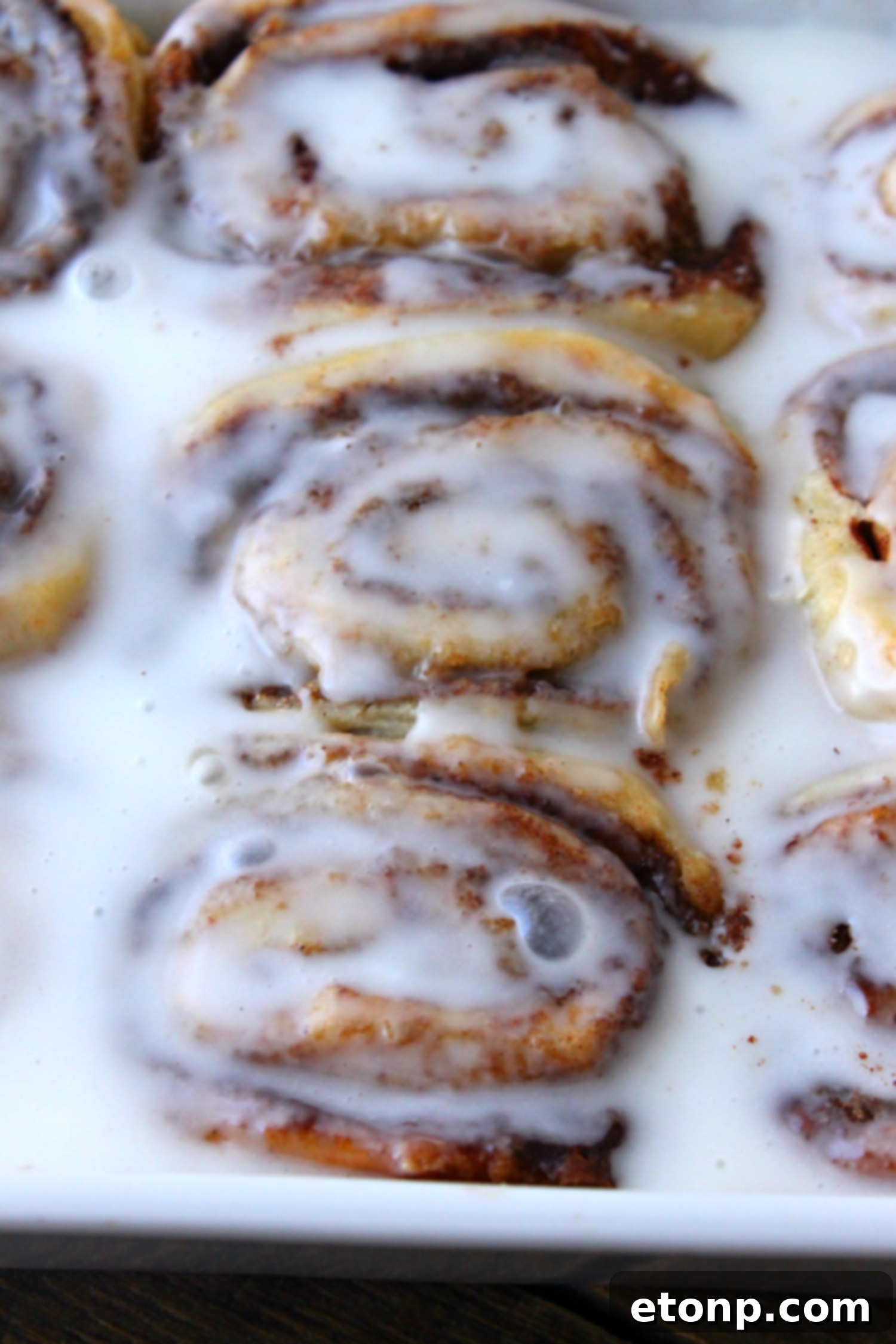45 Minute Cinnamon Roll Magic 6 A delicious batch of cinnamon rolls, still in the baking dish, just out of the oven.