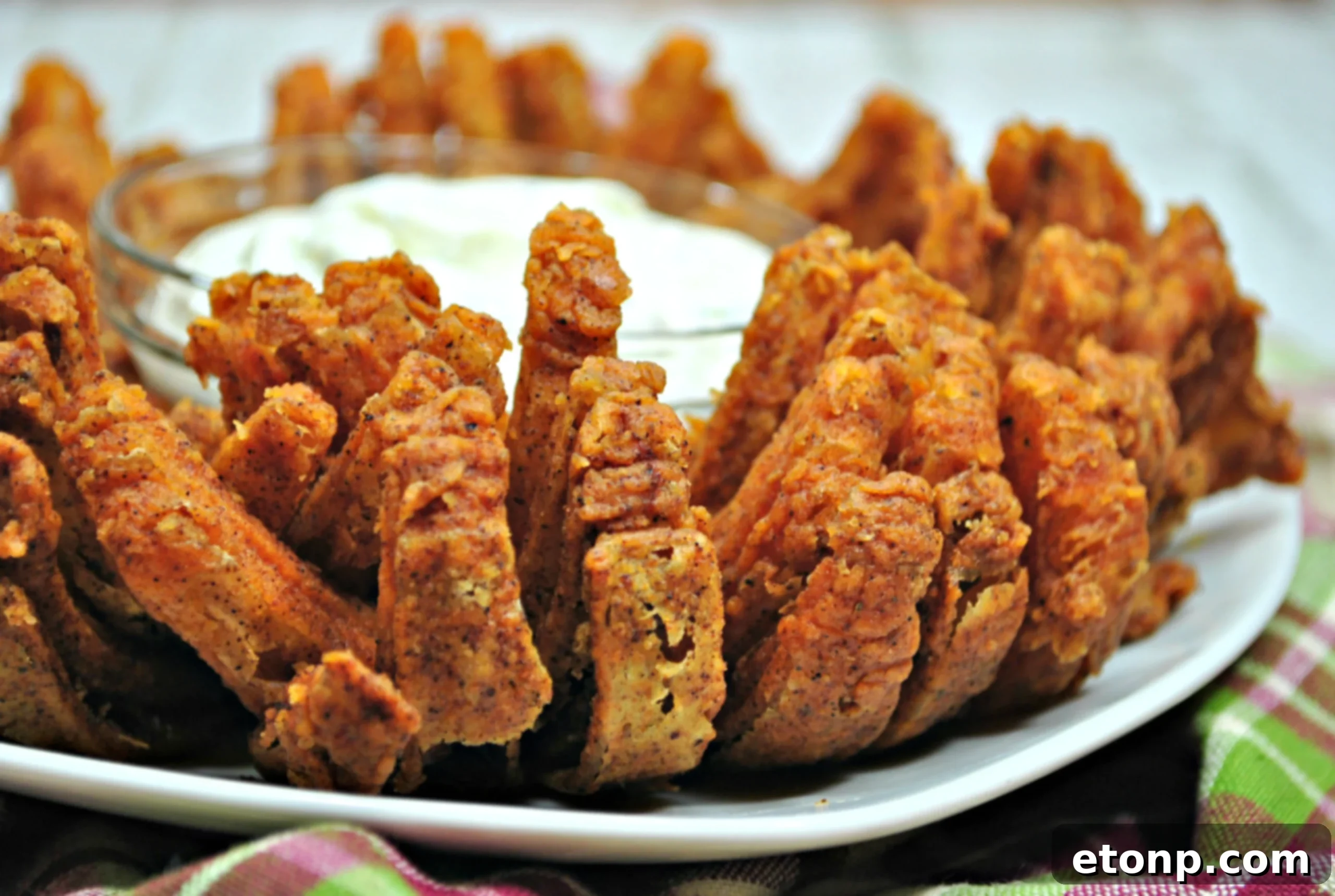 Crispy Bloomin' Onion served hot and ready to eat, showing its golden brown petals