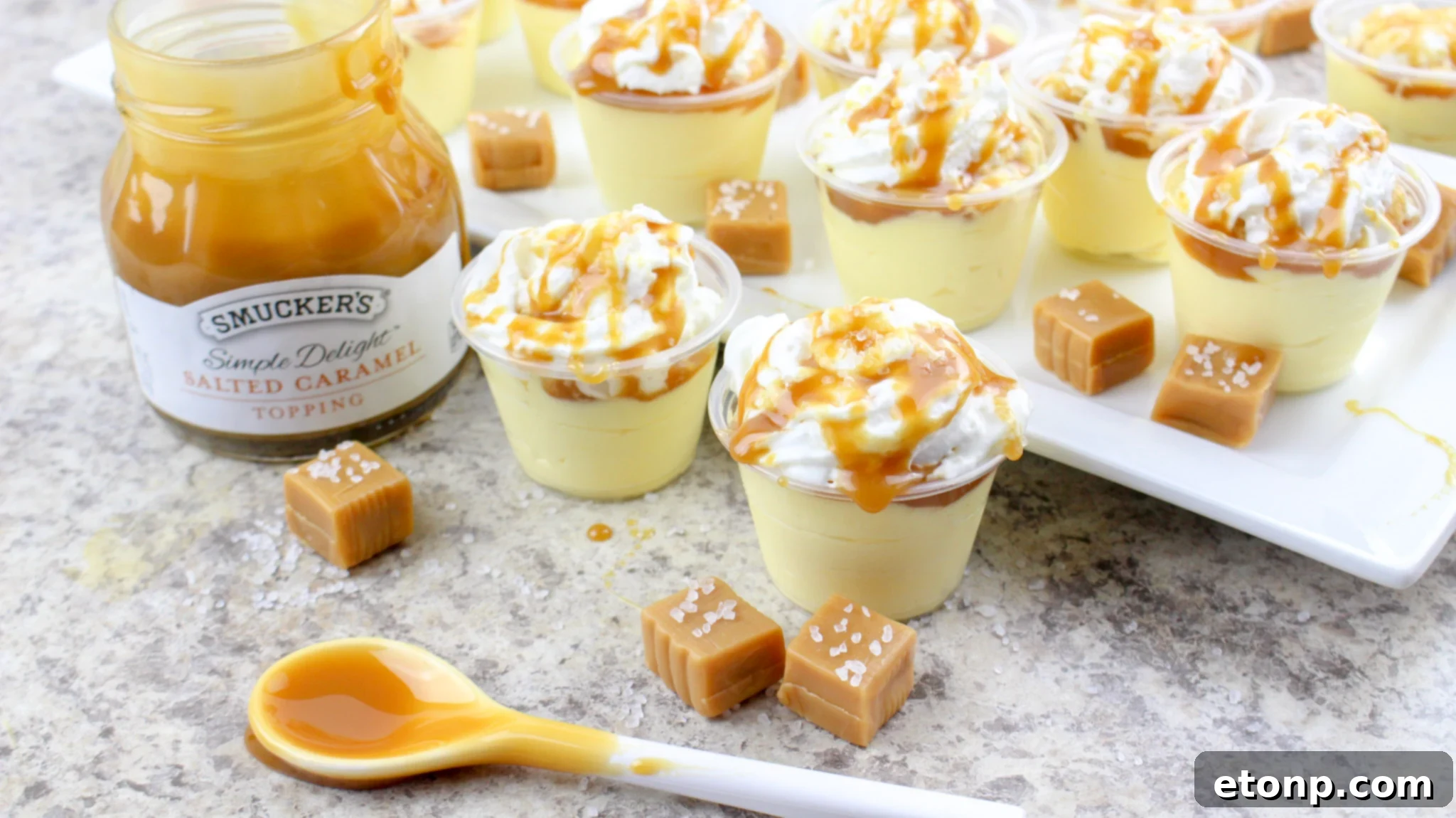 Overhead view of multiple Salted Caramel Pudding Shots with elegant toppings