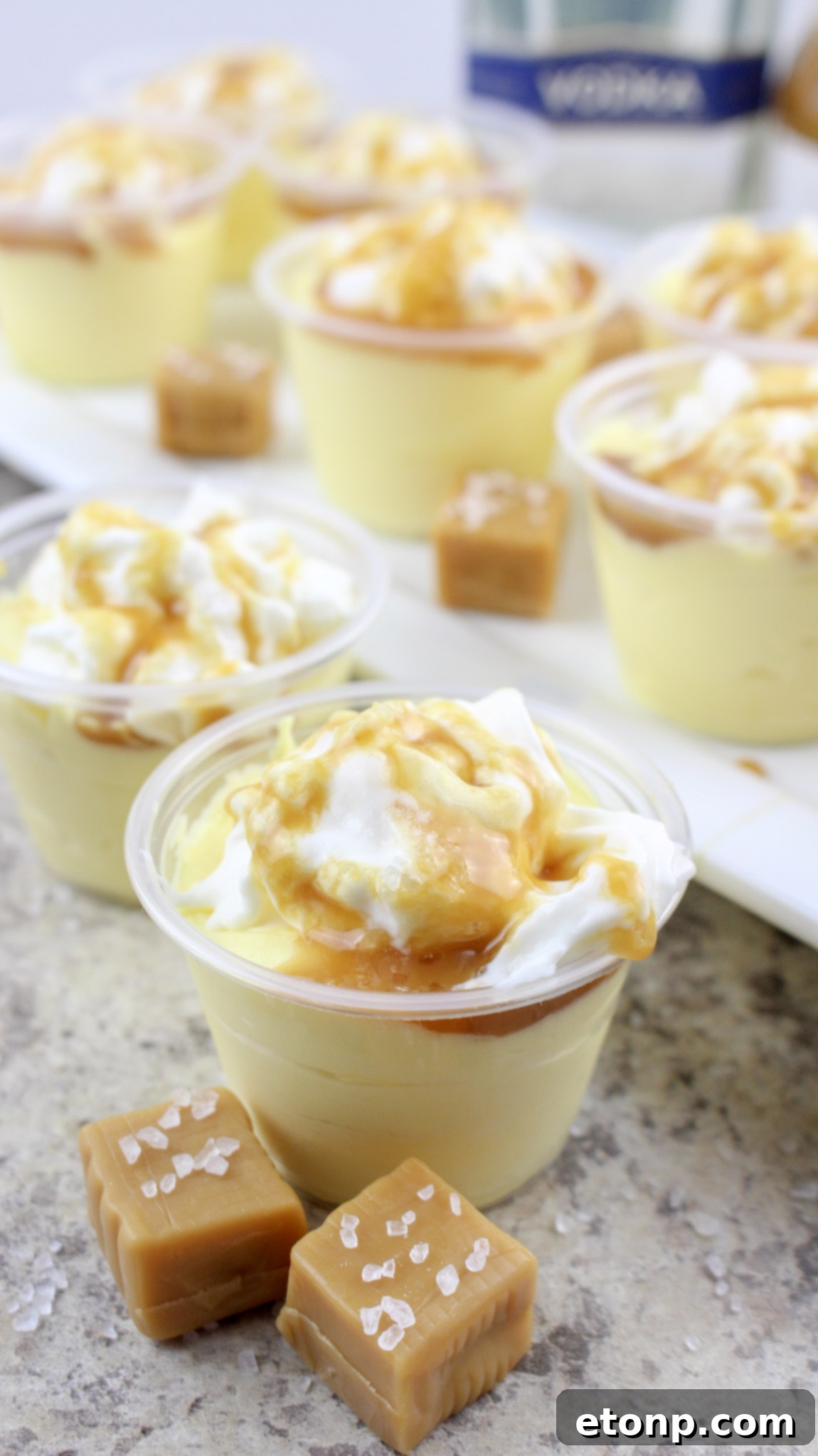 Multiple Salted Caramel Pudding Shots in various stages of topping