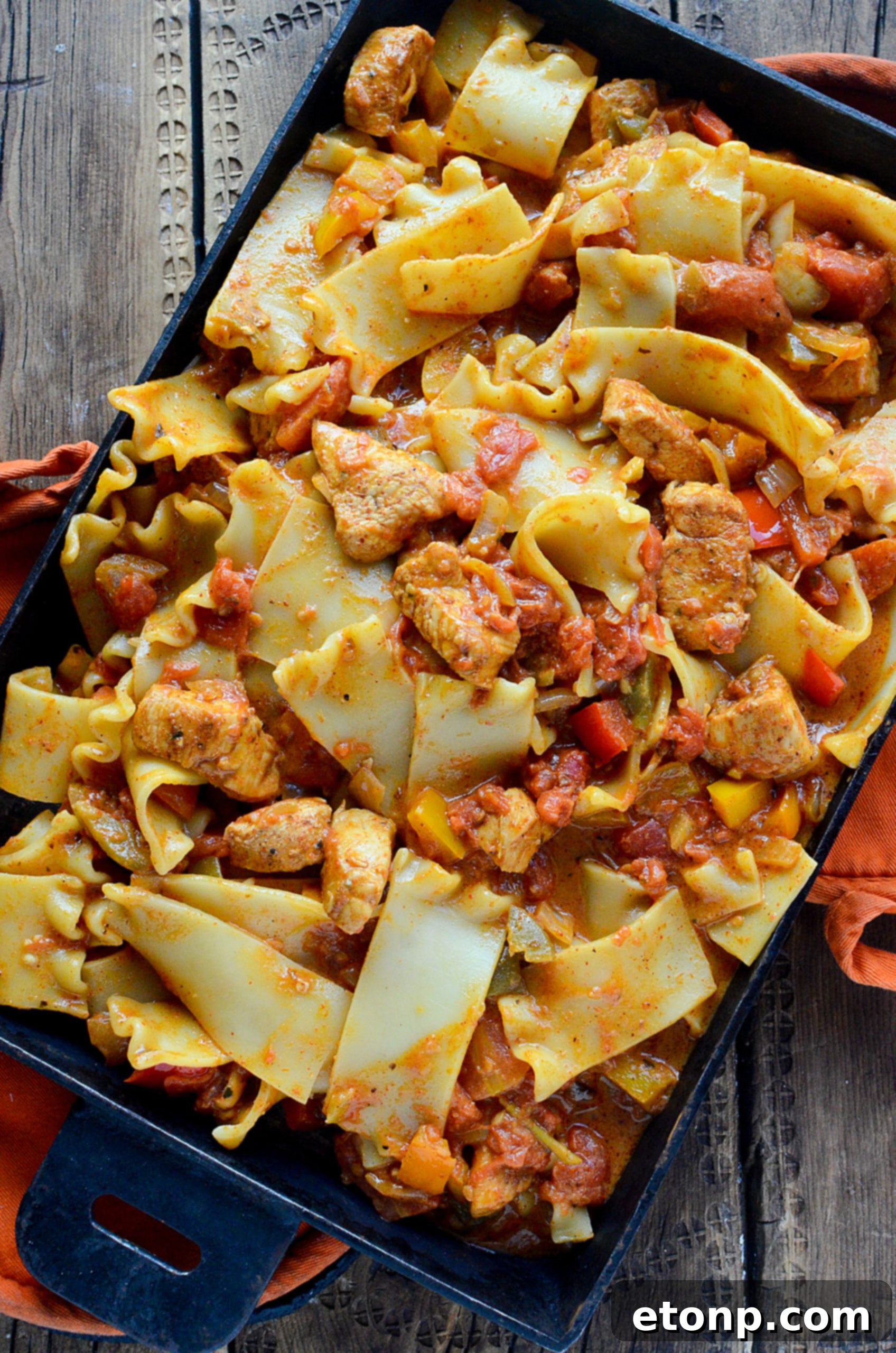 Serving of chicken fajita pasta garnished with fresh herbs