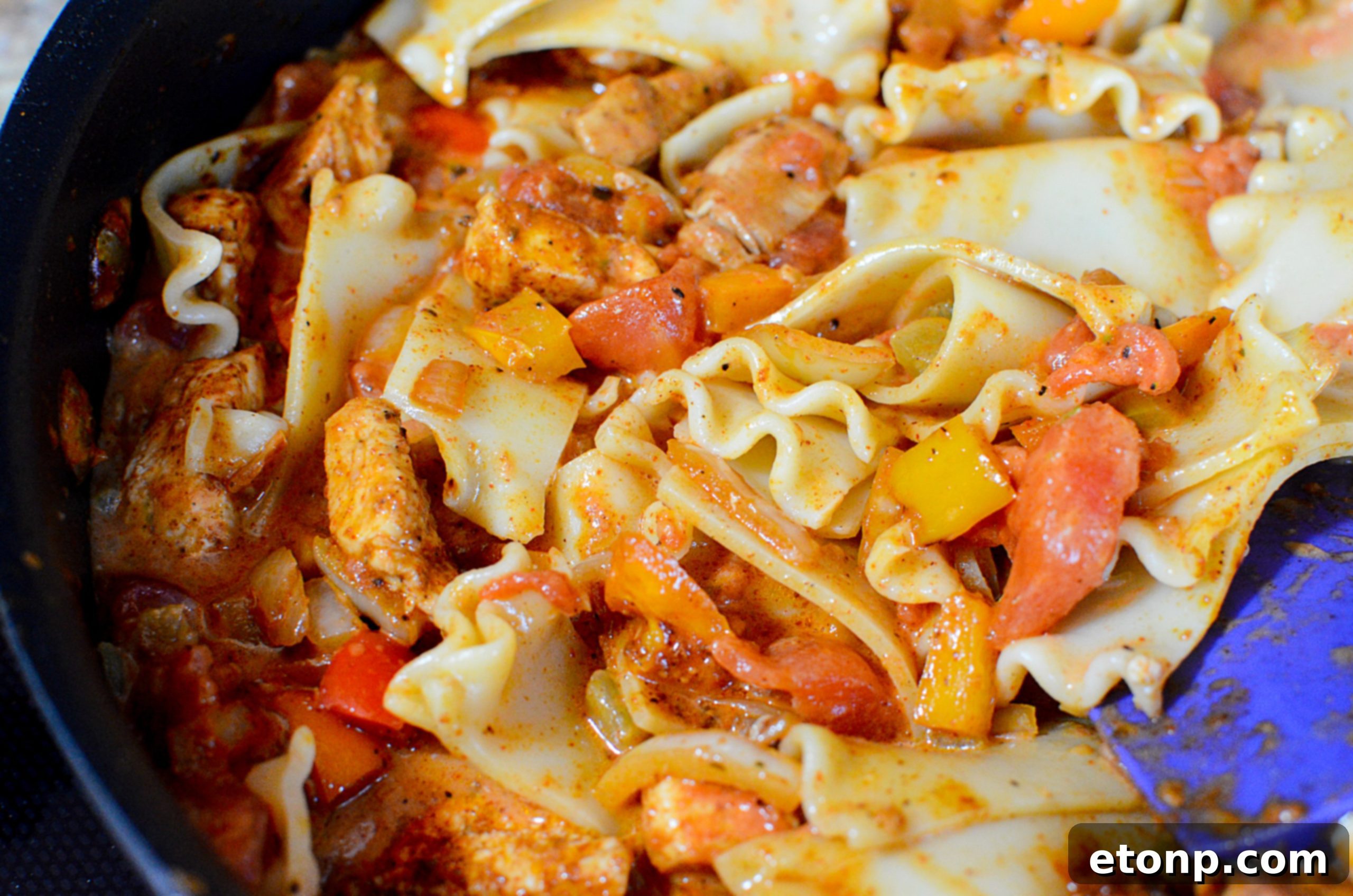 Ingredients for chicken fajita pasta laid out on a counter