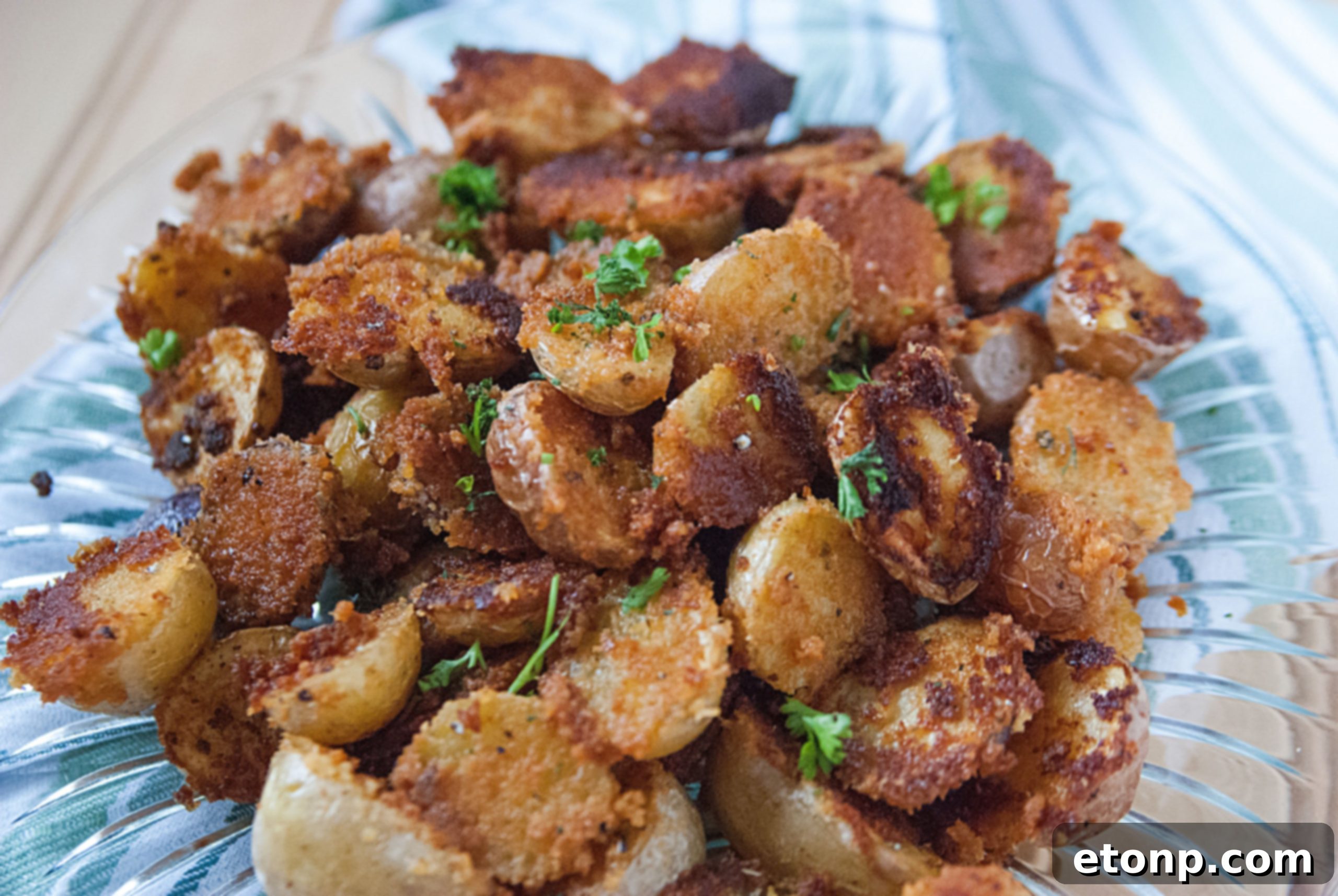 Seasoned garlic parmesan potatoes before baking