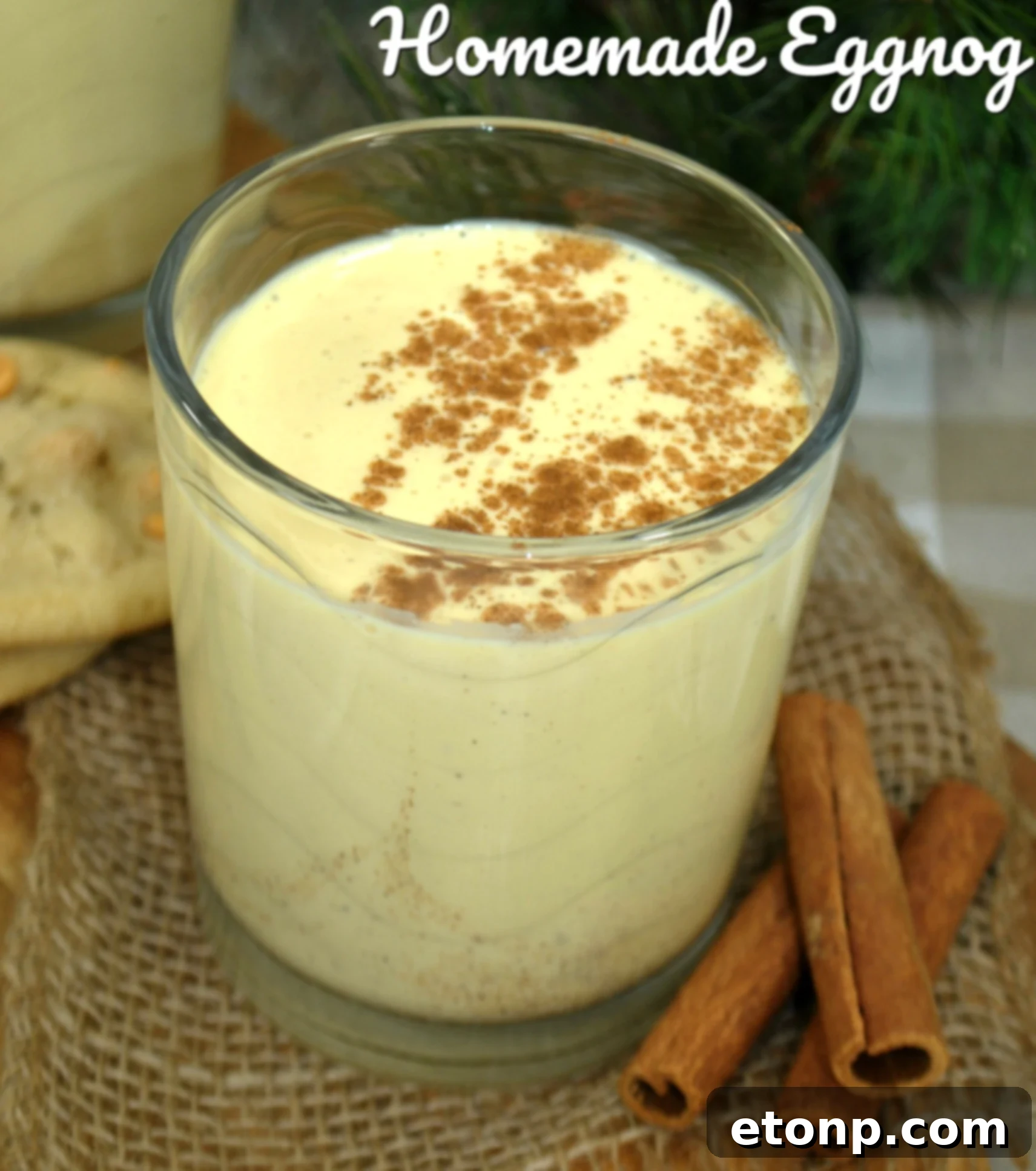 Classic Homemade Eggnog 2 A beautifully garnished glass of homemade eggnog, featuring a sprinkle of nutmeg and a cinnamon stick, ready to be enjoyed during the festive season. Perfect for holiday gatherings.