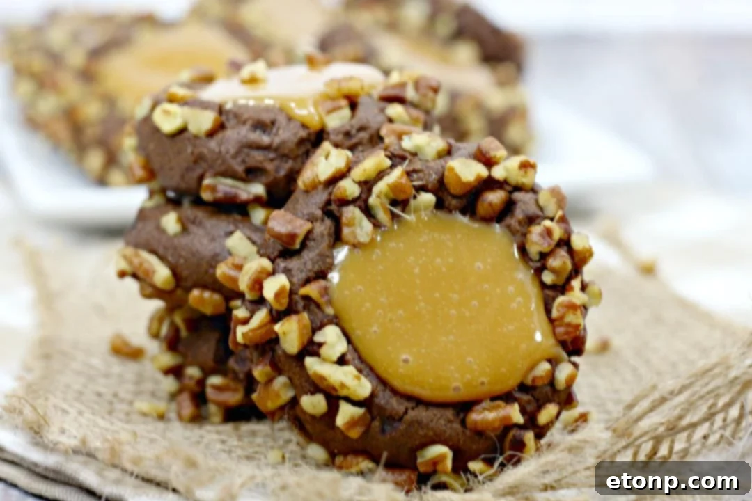 A festive plate of Turtle Thumbprint Cookies ready for sharing, embodying pure deliciousness with chocolate, melted caramel, and nuts.