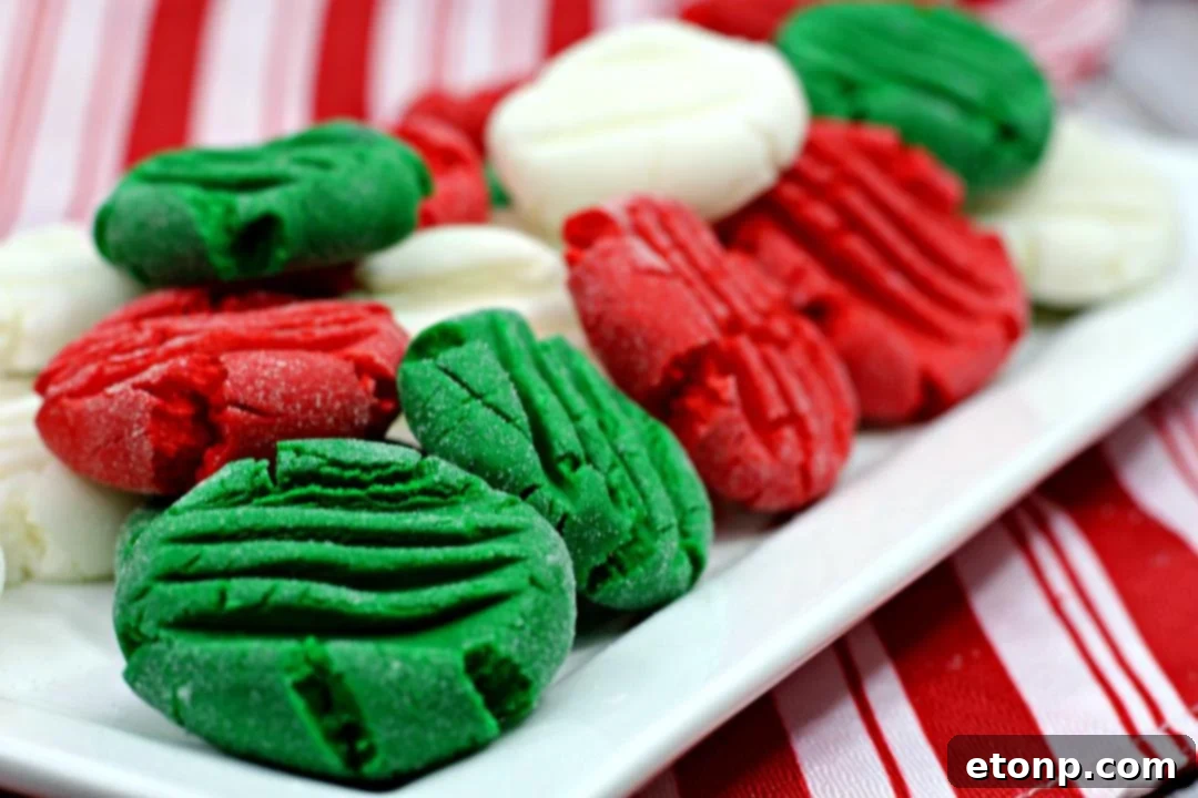 A festive array of red, green, and white peppermint patties on a holiday cookie tray.