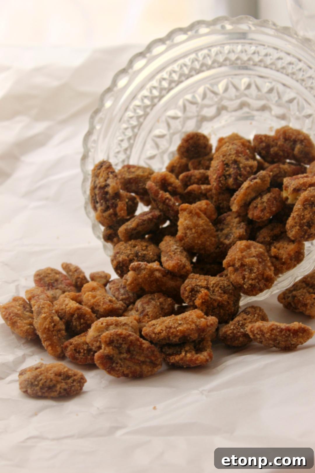 Sweet Cinnamon Pecan Crunch 4 Small gift bags filled with cinnamon sugar roasted pecans, tied with festive ribbons, perfect for Christmas.