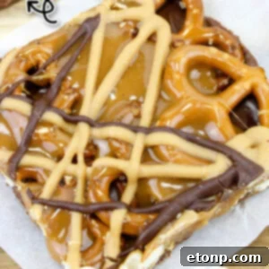 No Bake Caramel Pretzel Crack Bars on a white sheet