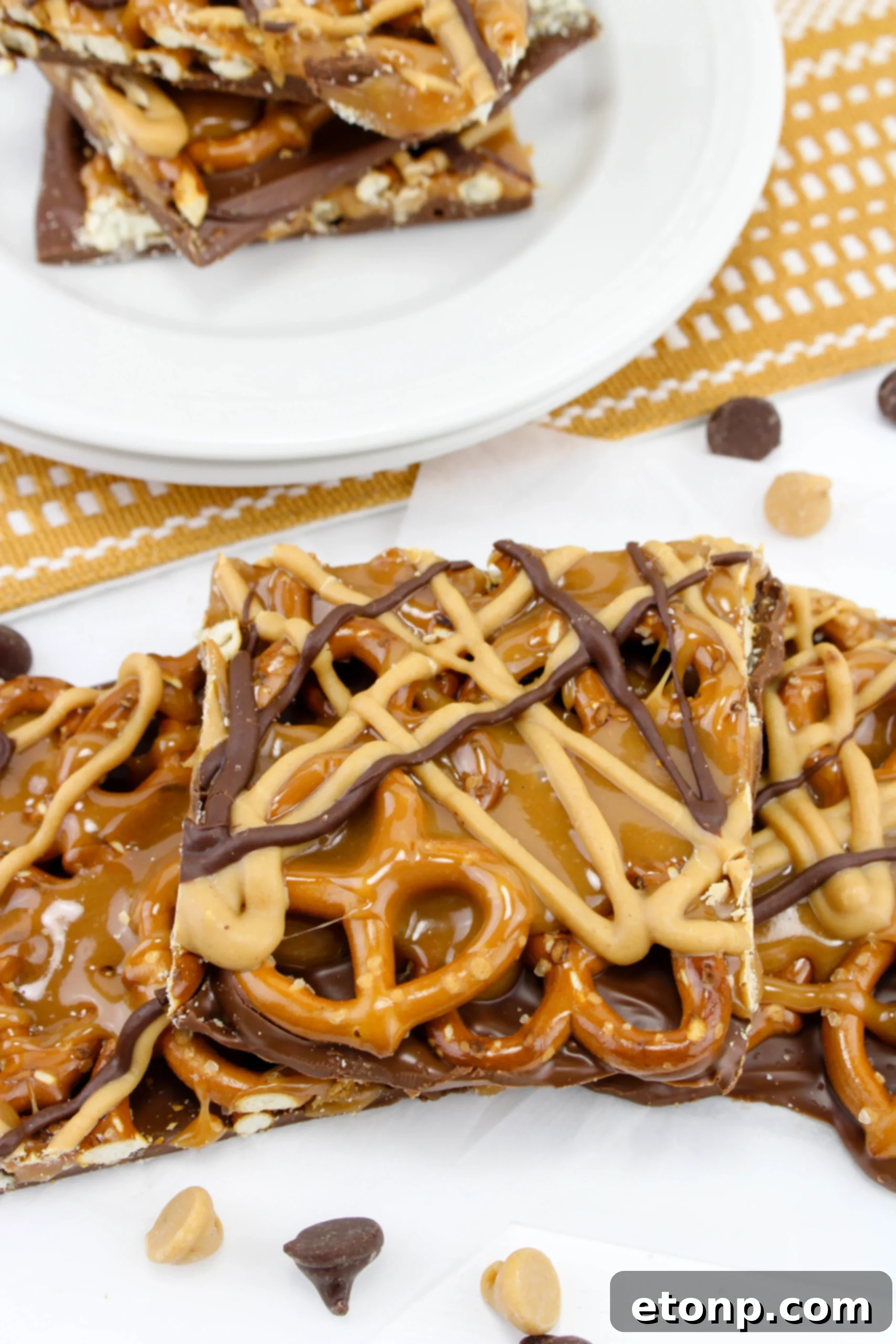 Salty Sweet No-Bake Pretzel Caramel Bars 9 No Bake Caramel Pretzel Crack Bars on a serving platter