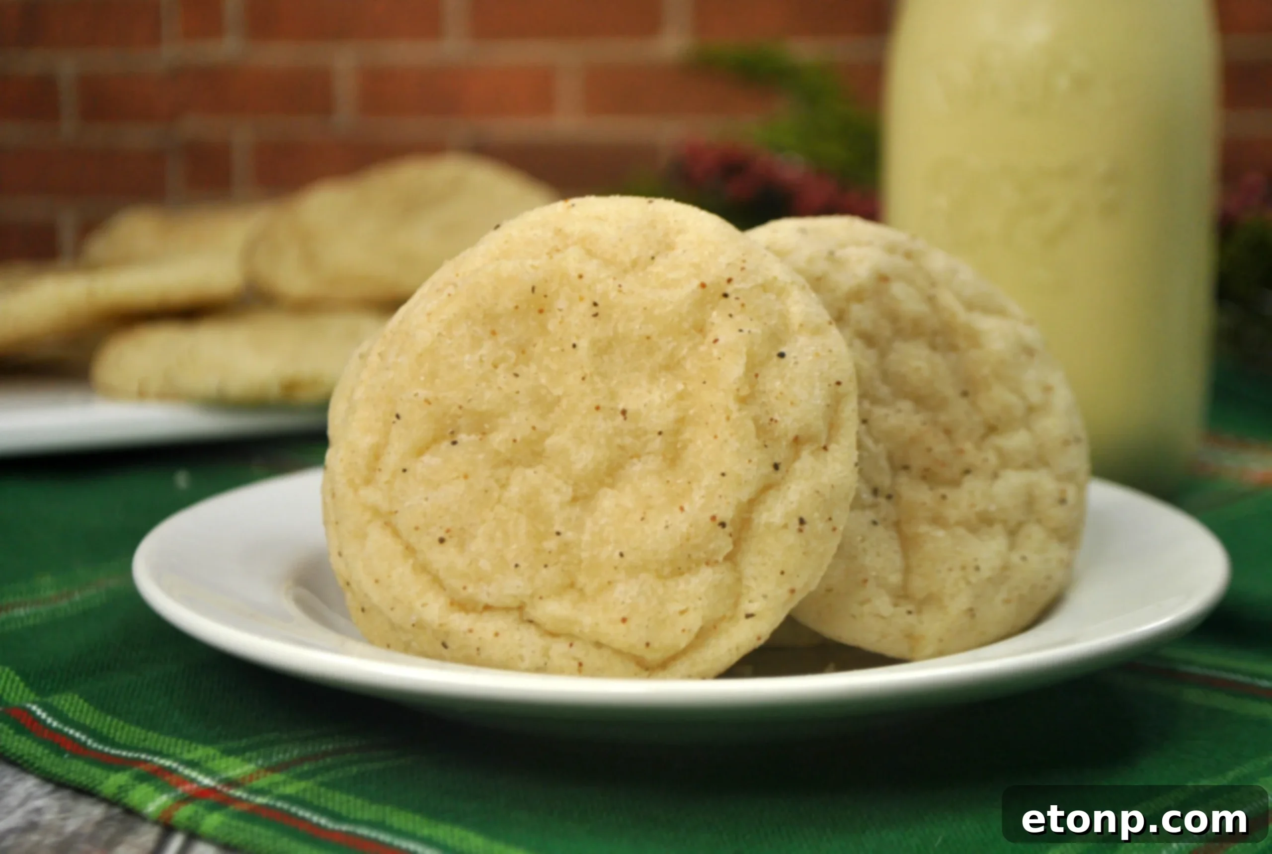 Close-up of baked eggnog cookies, showing their soft texture and delicate appearance.