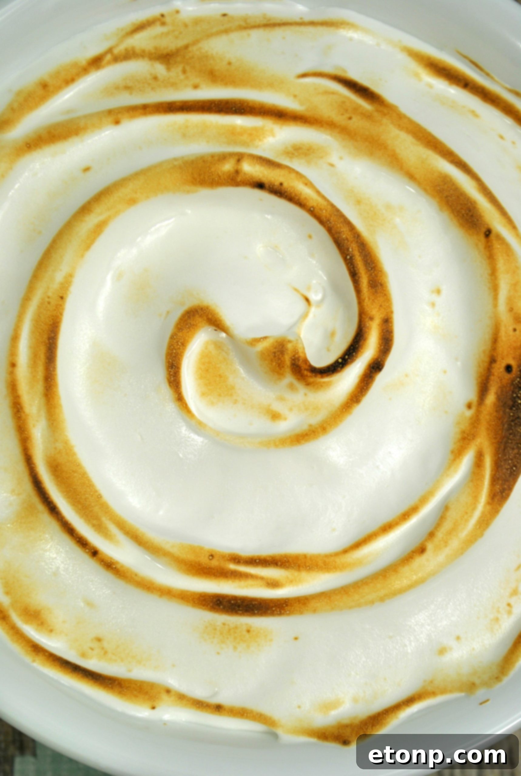 Toasted Marshmallow Frosting on a cupcake, close-up