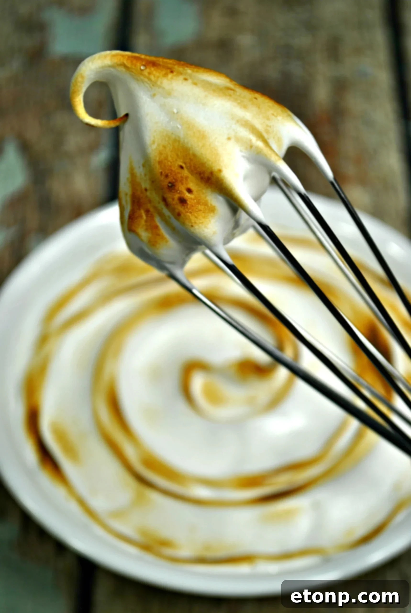 A bowl of creamy marshmallow frosting