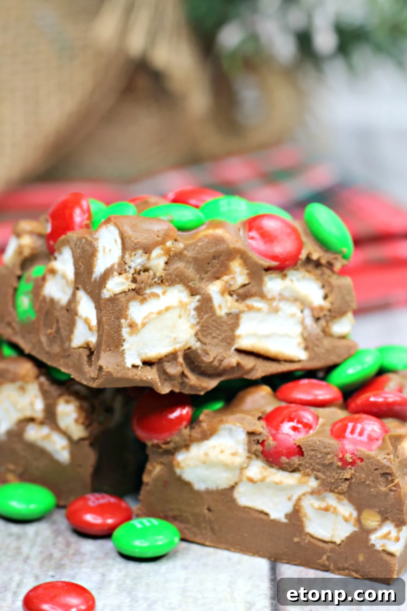 Close-up of a rich, fudgy no-bake marshmallow bar, highlighting its mouthwatering texture.
