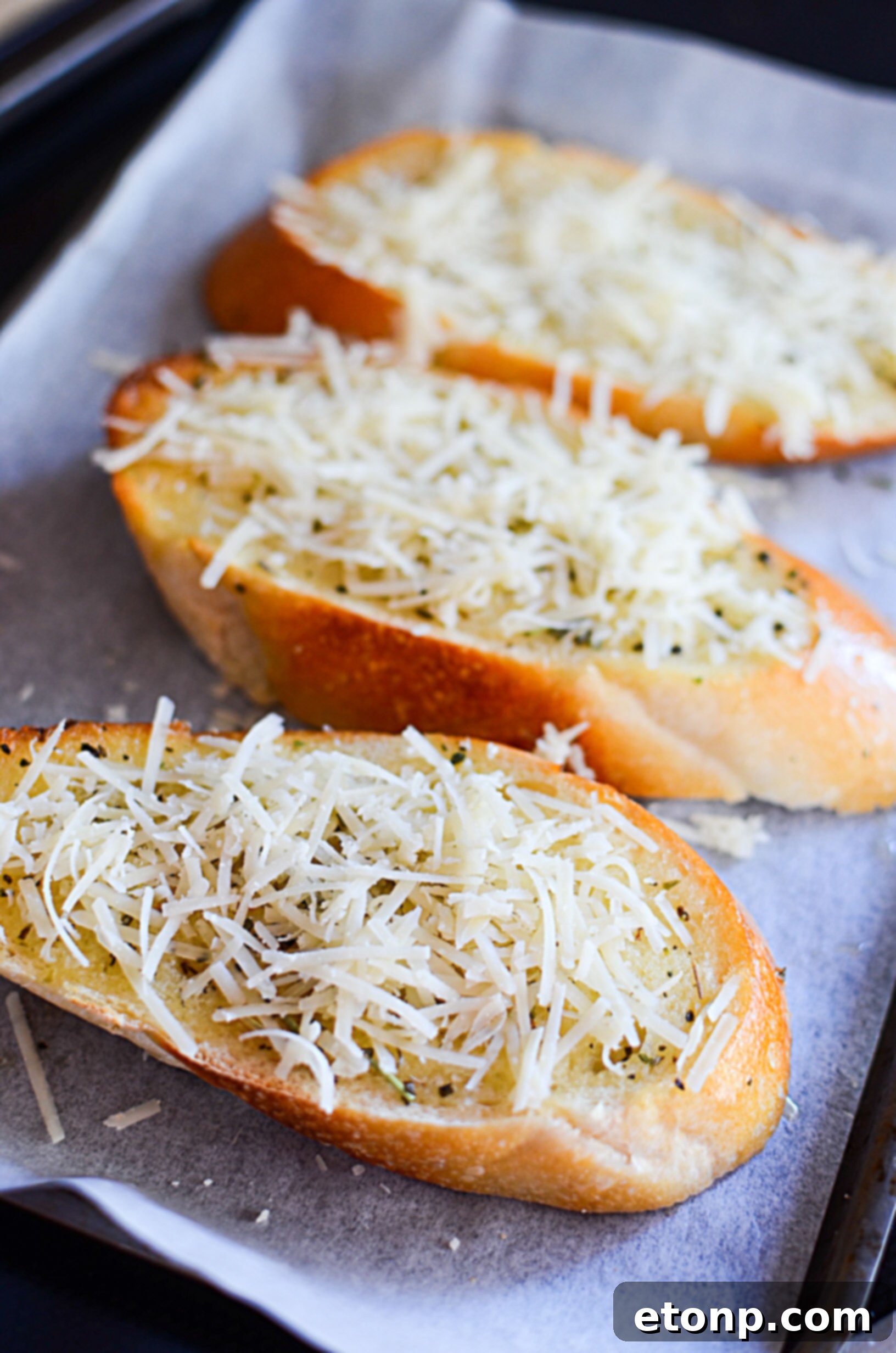 Various types of bread suitable for garlic bread, including French and Italian loaves.