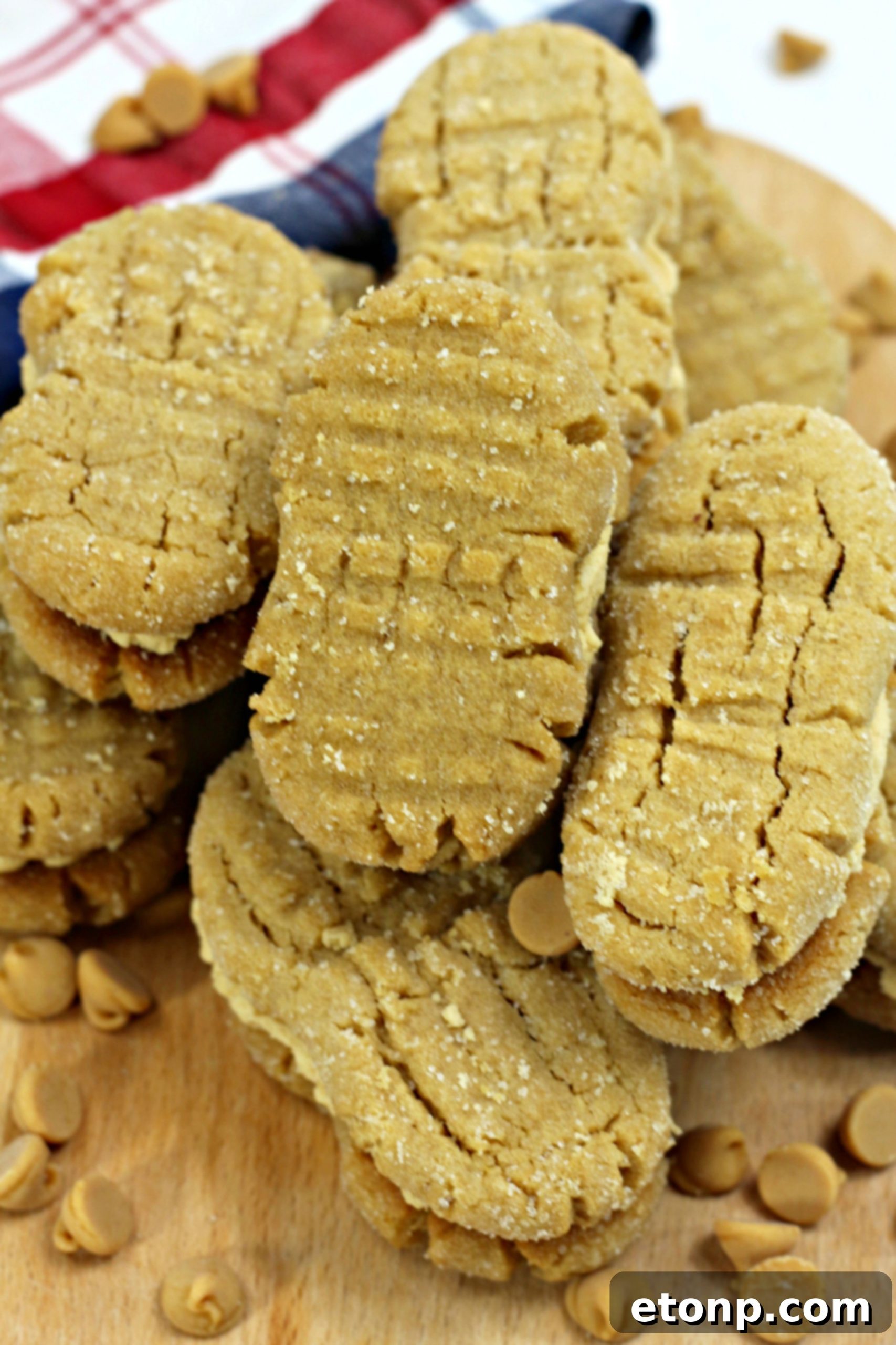 A plate of baked Nutterbutter cookies, some waiting for filling, others already sandwiched.