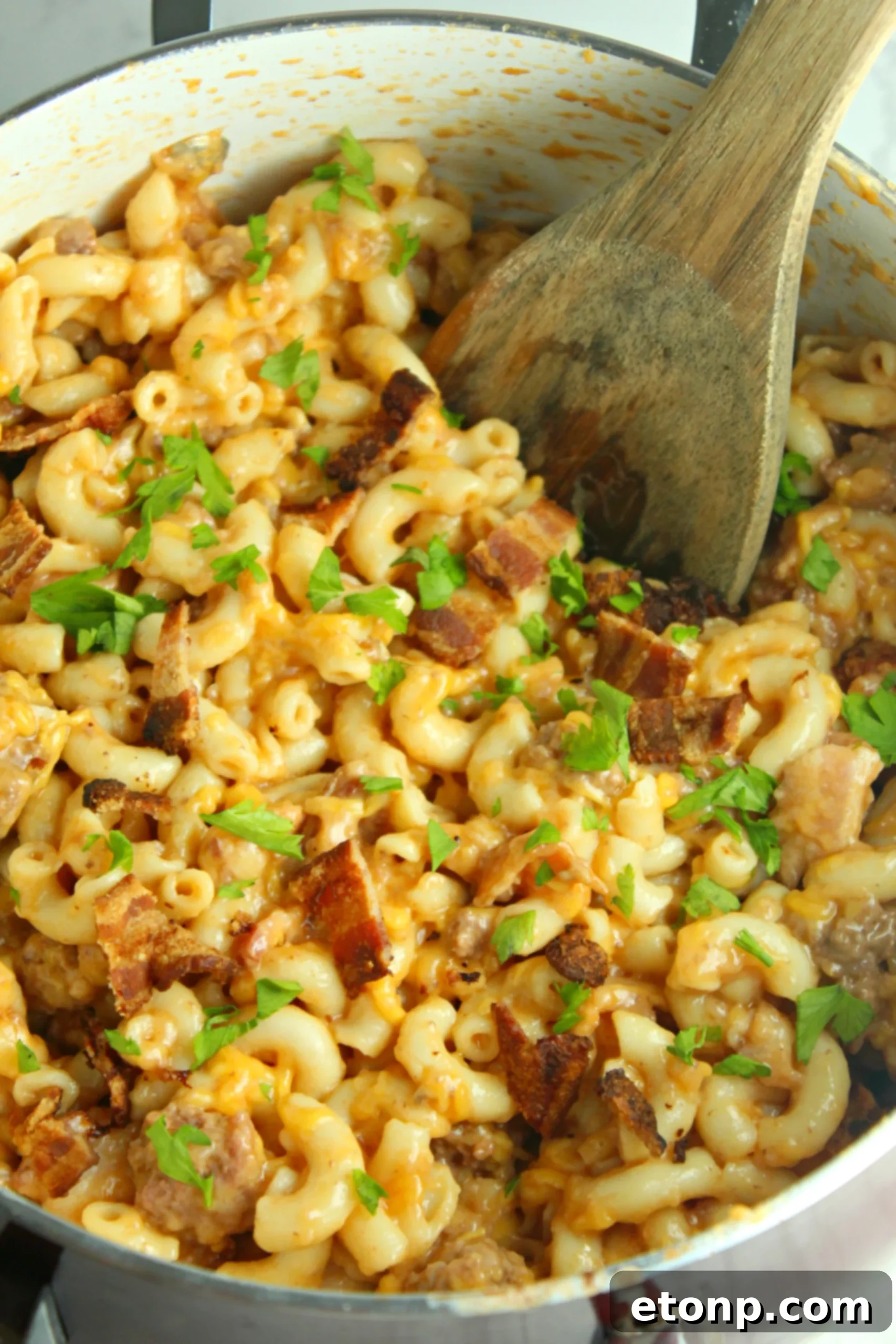 Loaded Ooey Gooey Bacon Cheeseburger Pasta 7 A freshly made batch of Bacon Cheeseburger Pasta, ready to be served, with steam gently rising from the dish.