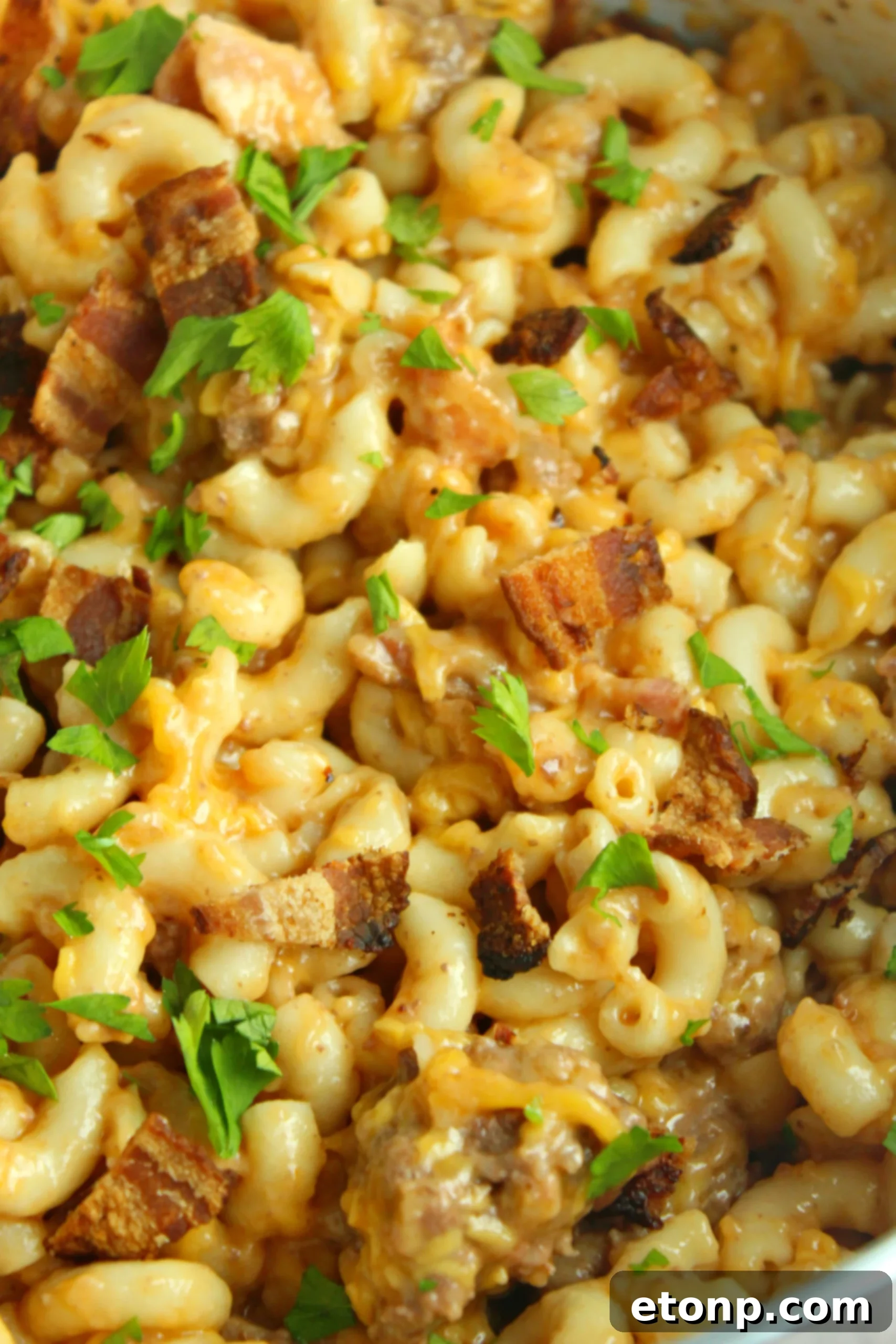 Loaded Ooey Gooey Bacon Cheeseburger Pasta 9 Overhead shot of the finished Bacon Cheeseburger Pasta, showcasing its inviting appearance and generous topping of cheese and bacon.