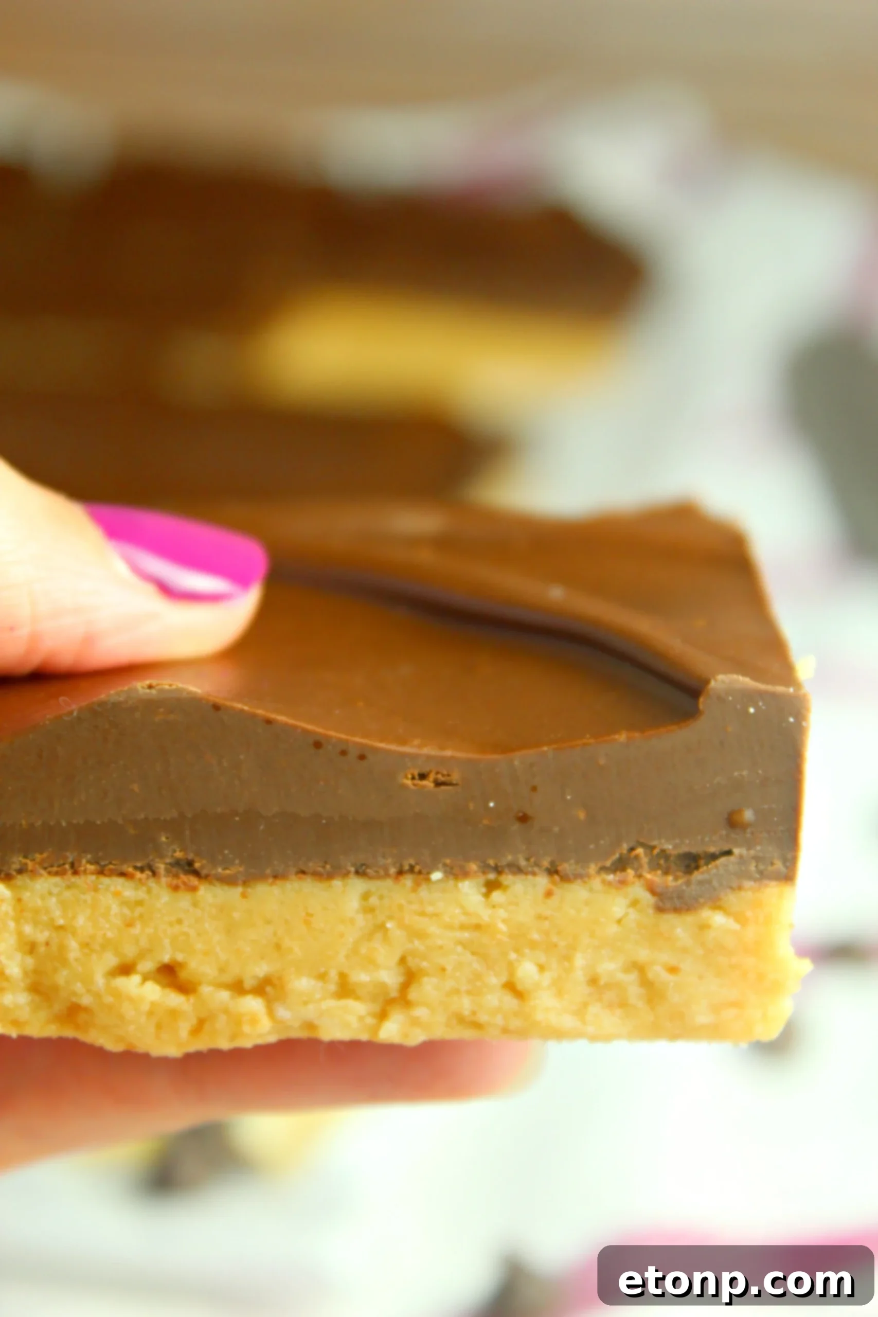 Multiple No-Bake Peanut Butter Cup Bars stacked, ready for sharing
