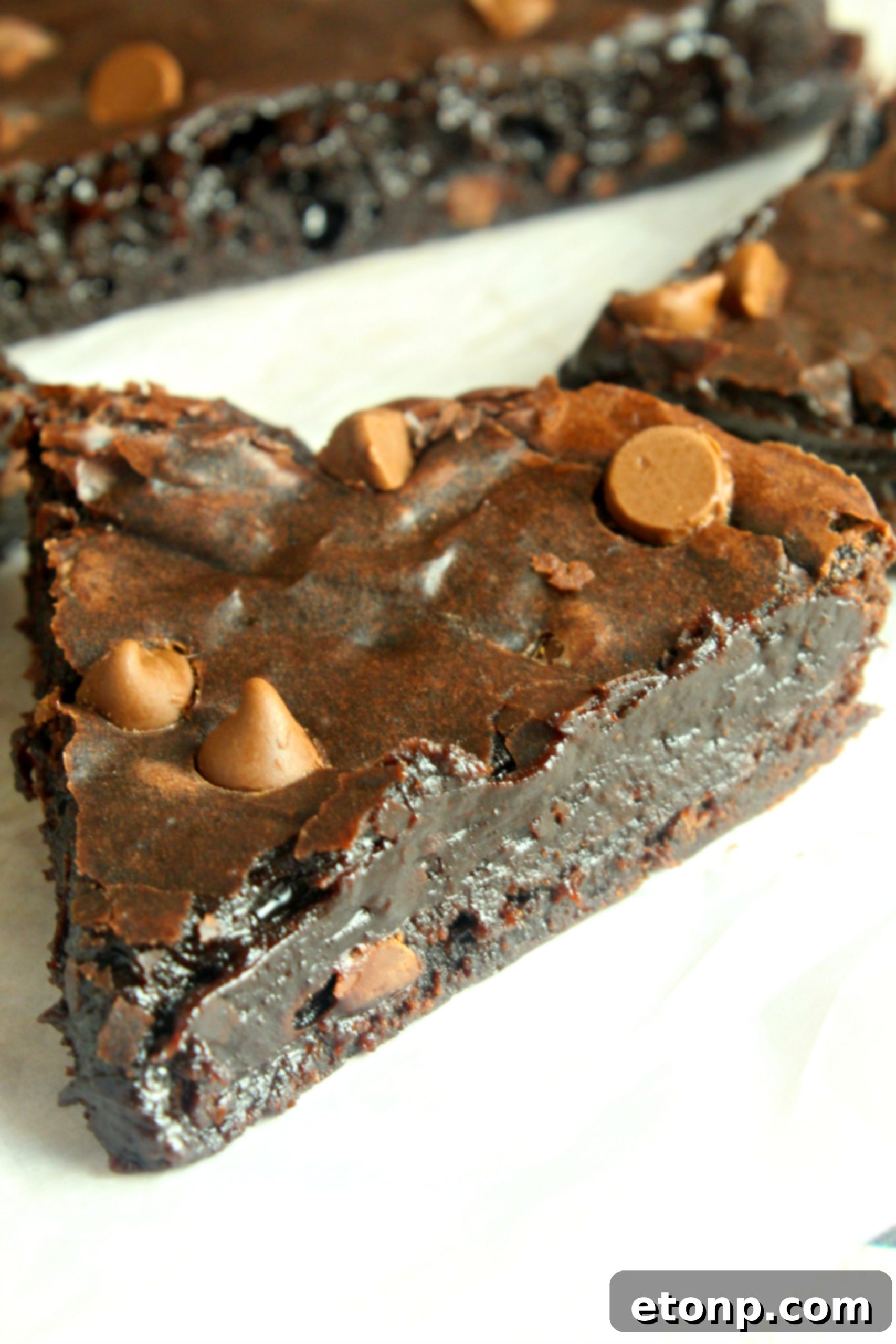 A perfectly baked slow cooker brownie with a rich, dark color and appealing texture