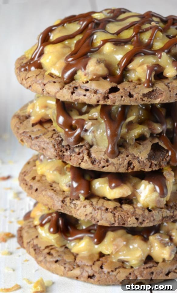 35+ Mouthwatering Cookie Delights 2 German Chocolate Brownie Cookies topped with gooey coconut pecan caramel frosting